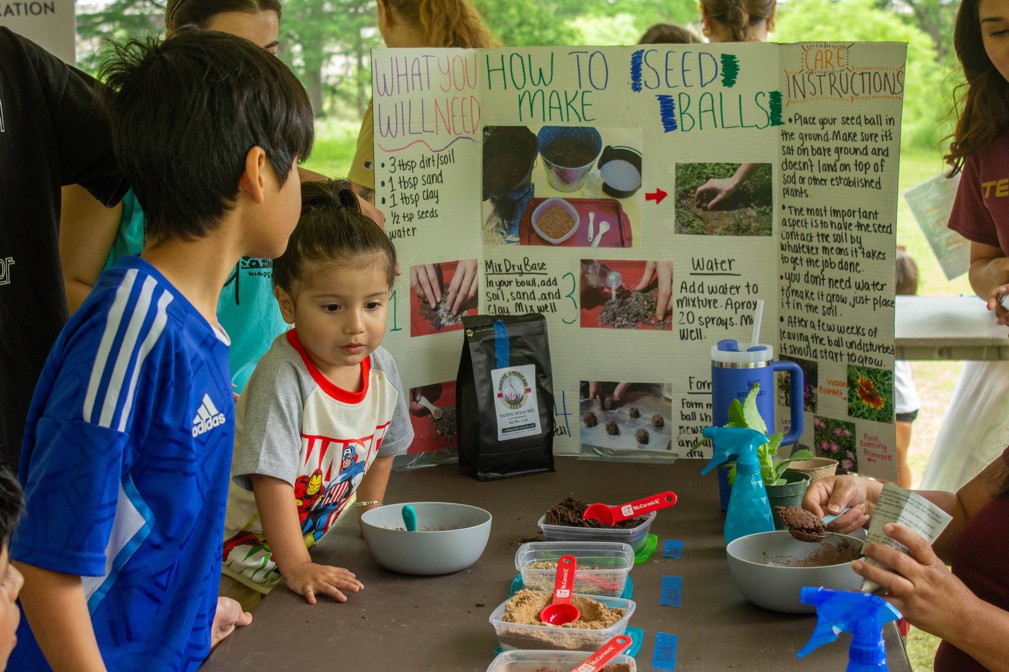 young children participate in earth day activity during event
