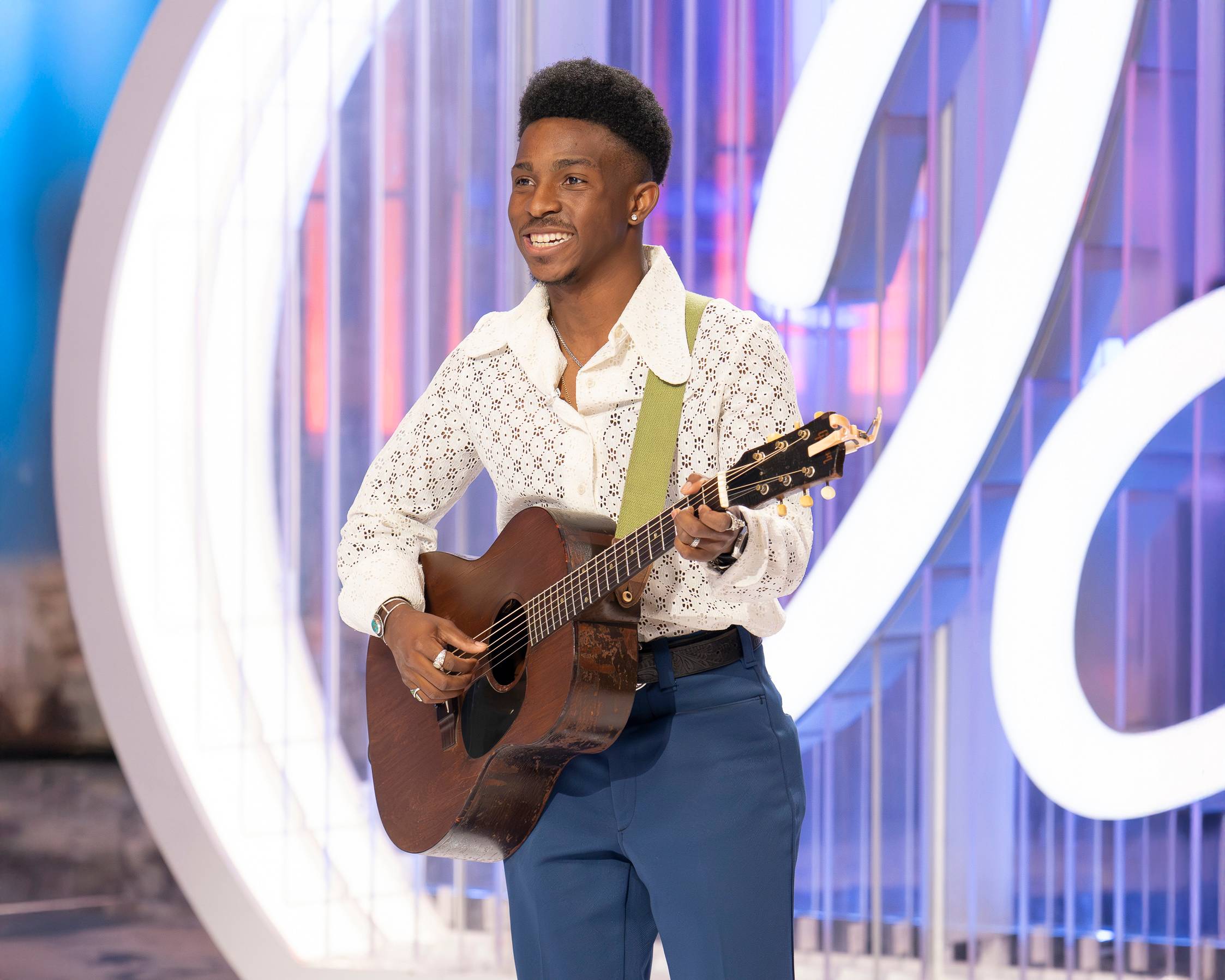 DJ Bartly playing acoustic guitar while auditioning for American Idol