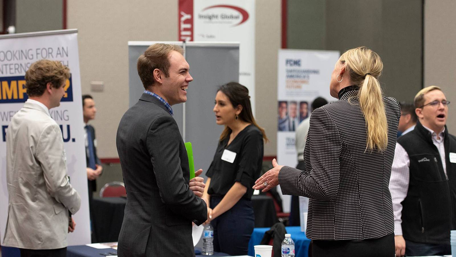 Recruiters and students in business attire