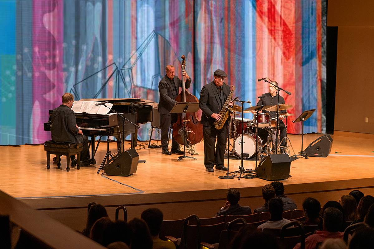 four piece jazz emsemble performing on stage