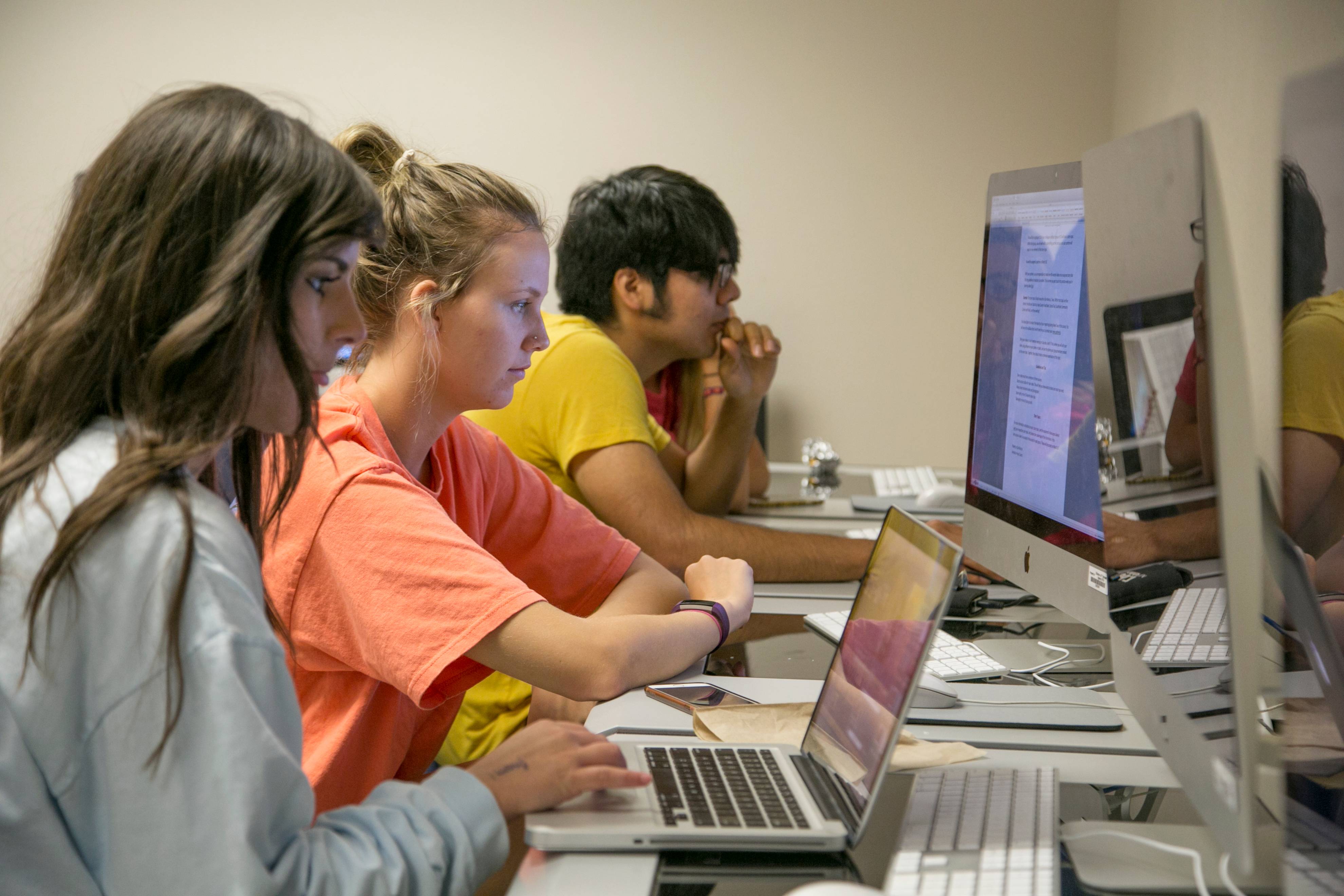 students work at computers in computer lab