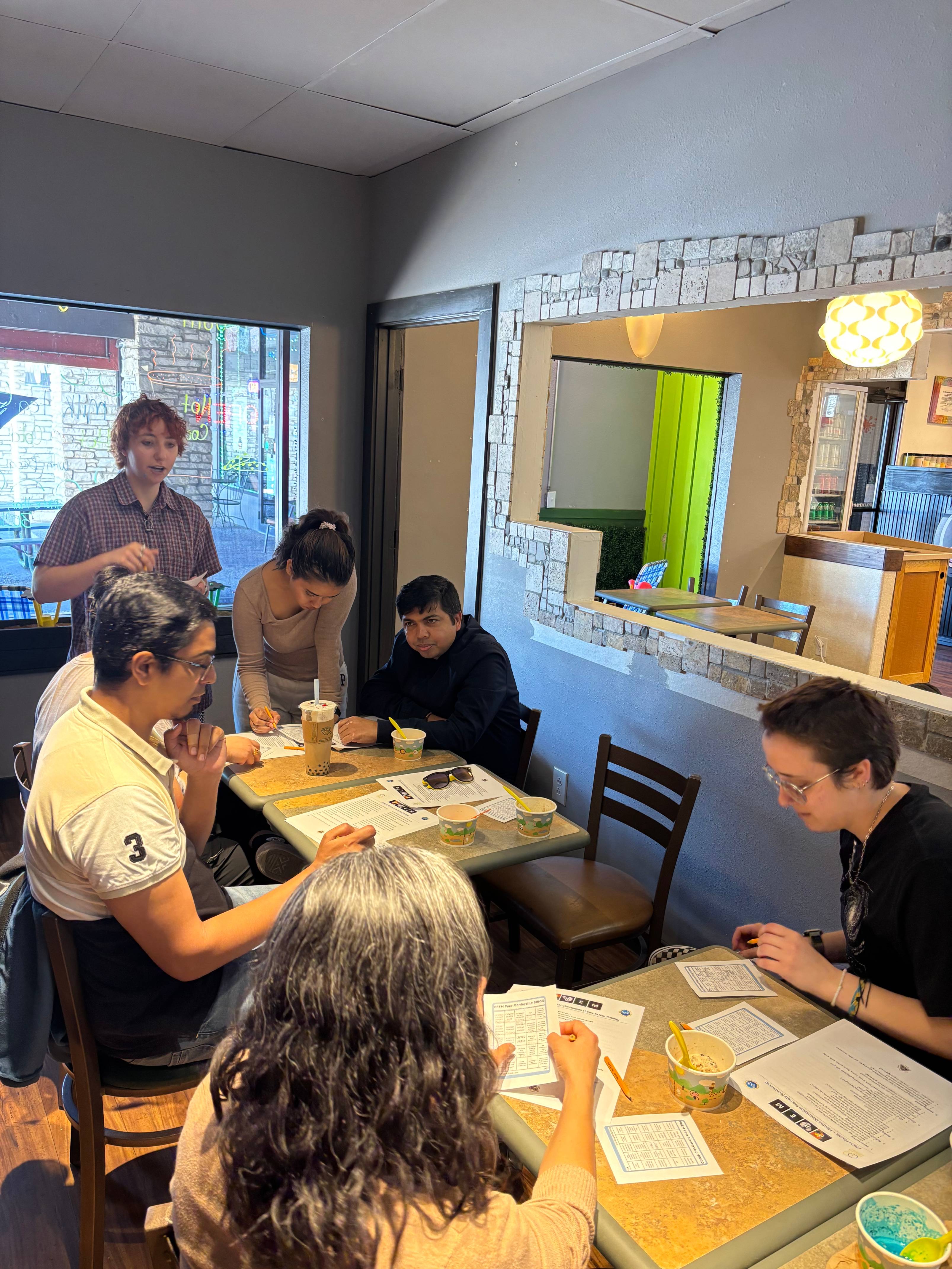 PREM Students participating in mentorship bingo with mentors and mentees