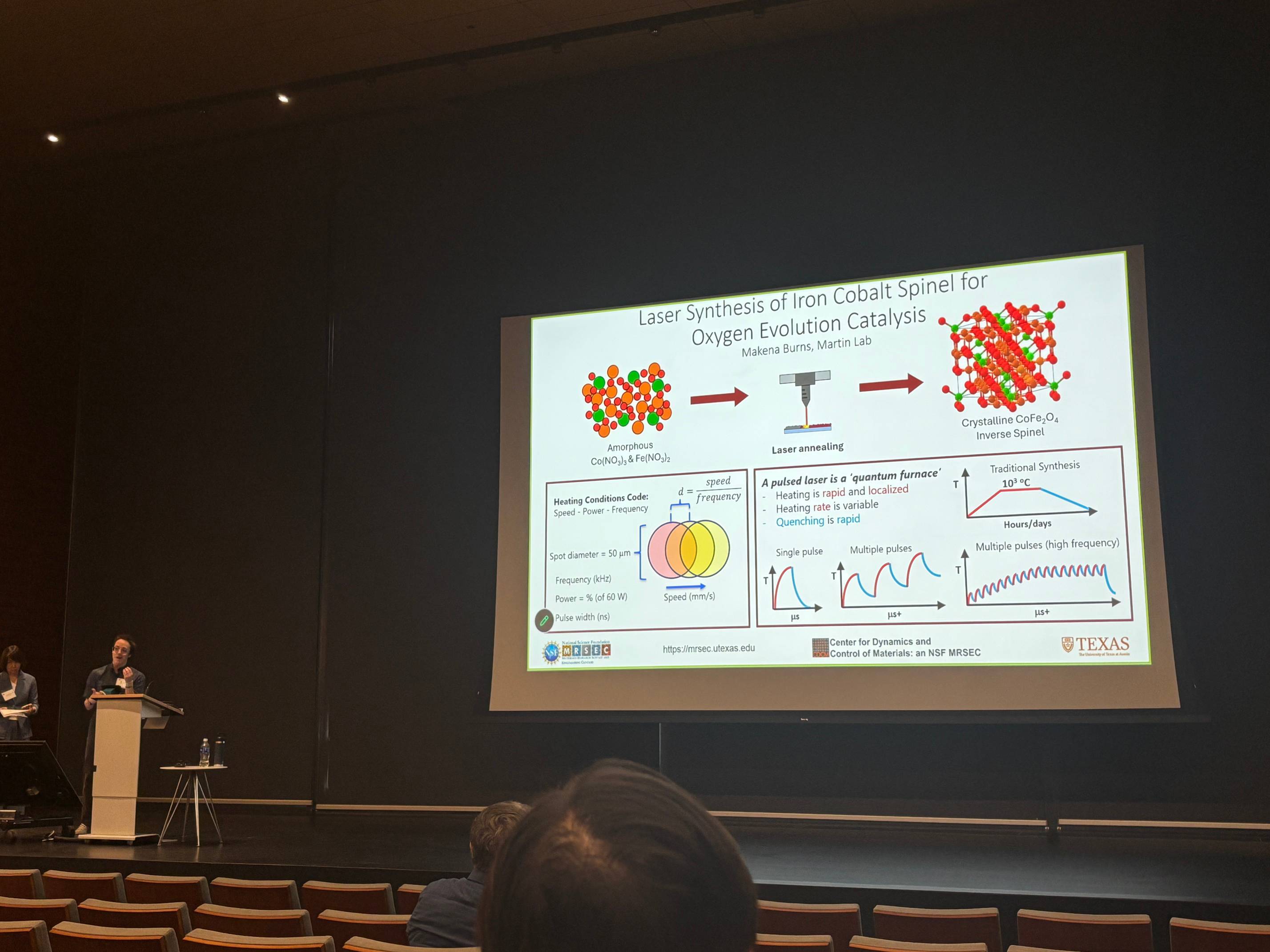 PREM student presenting research at stage of  UT MRSEC Annual Meeting Industry Day