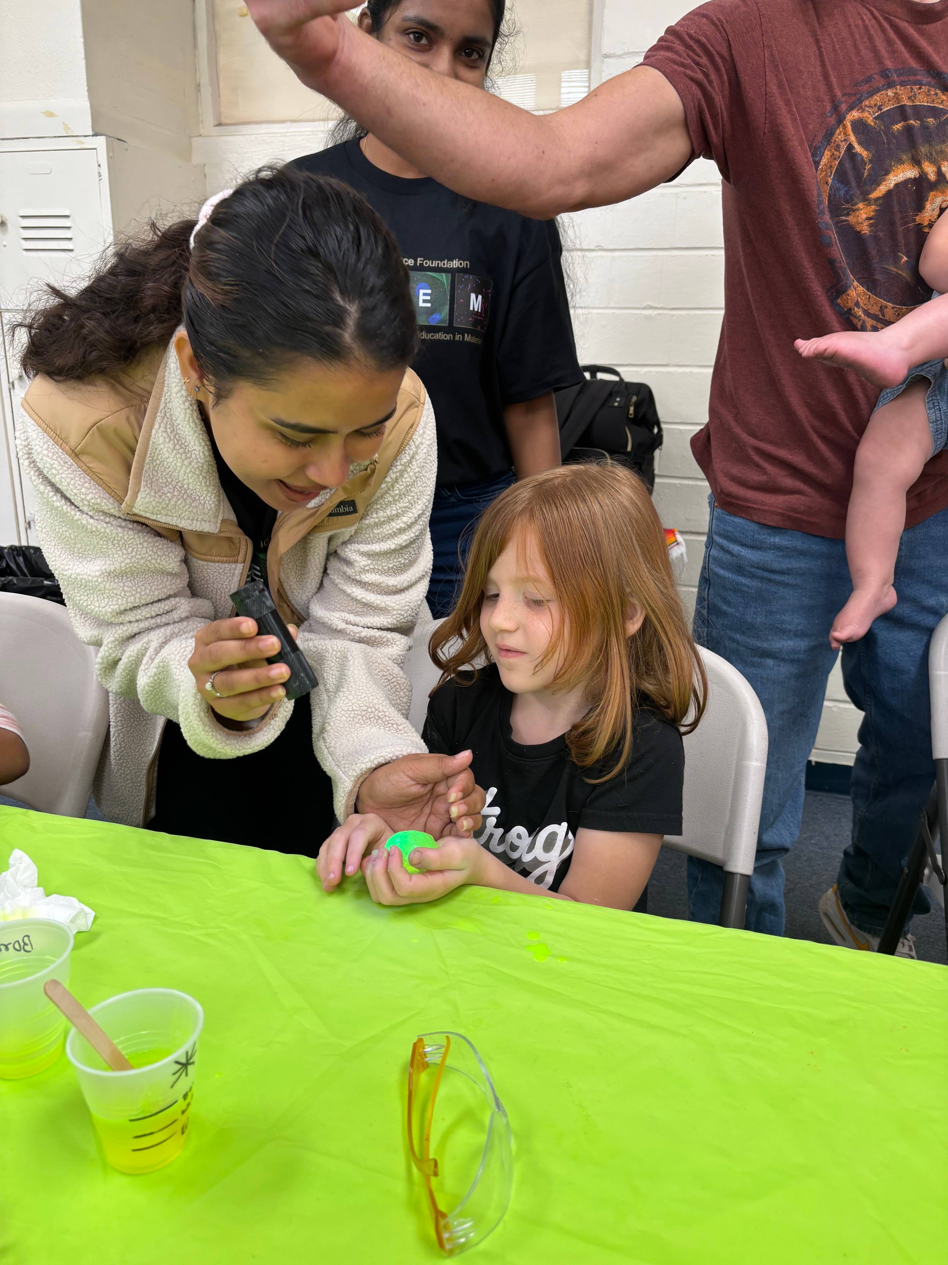PREM Student showcasing STEM Demos to children and families