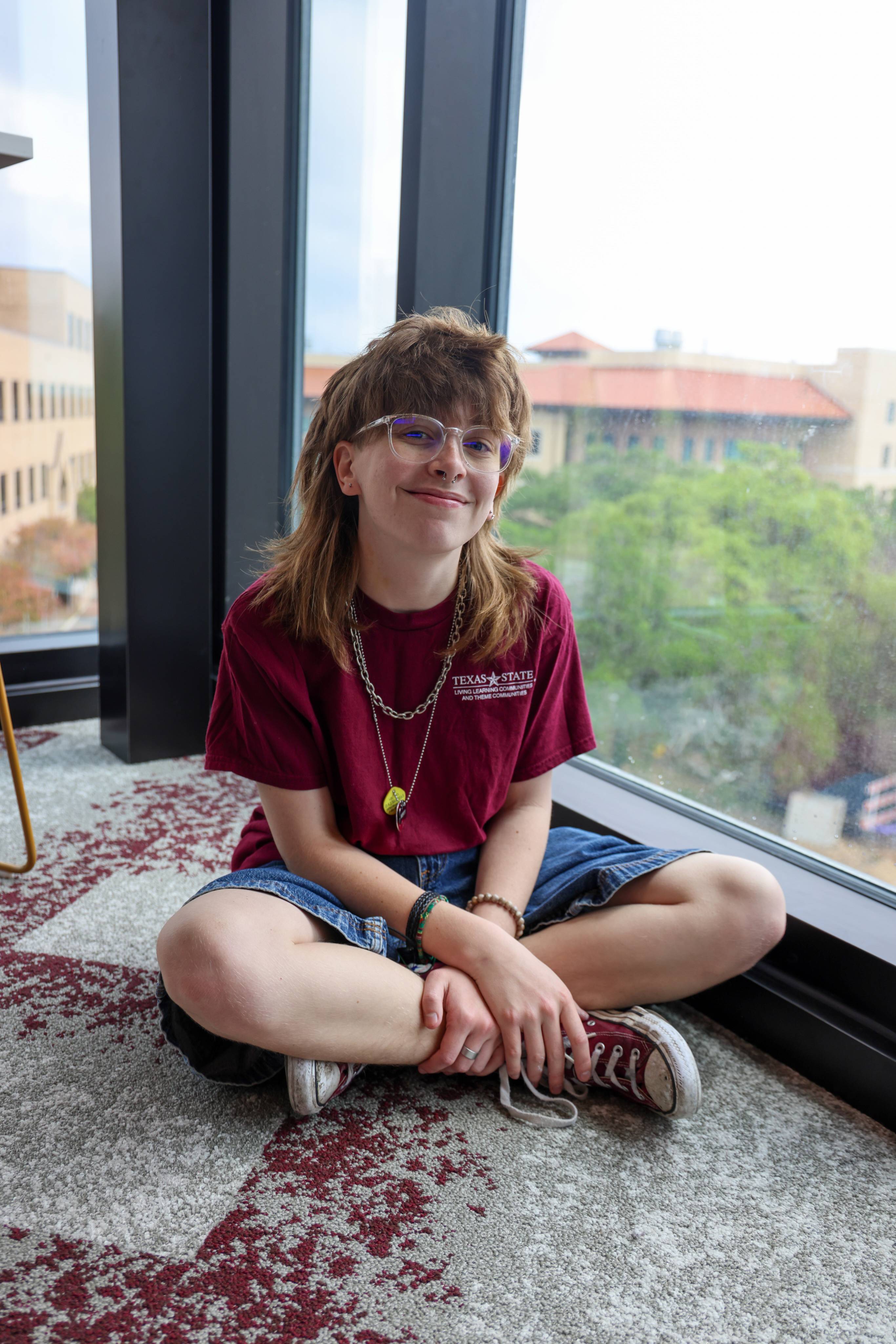 Student sitting on the floor 