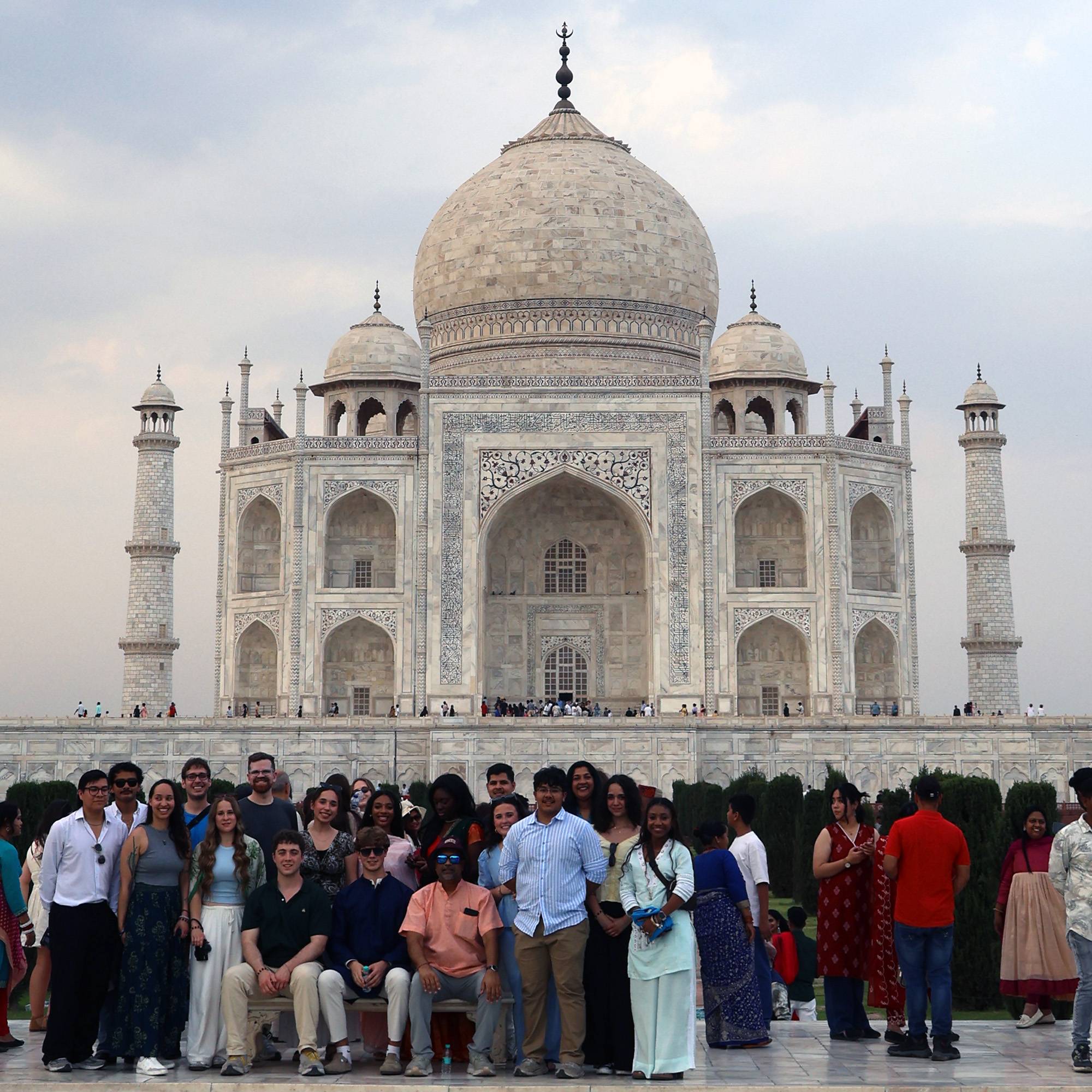 group of McCoy College students pose in front of the Taj Mahal in India