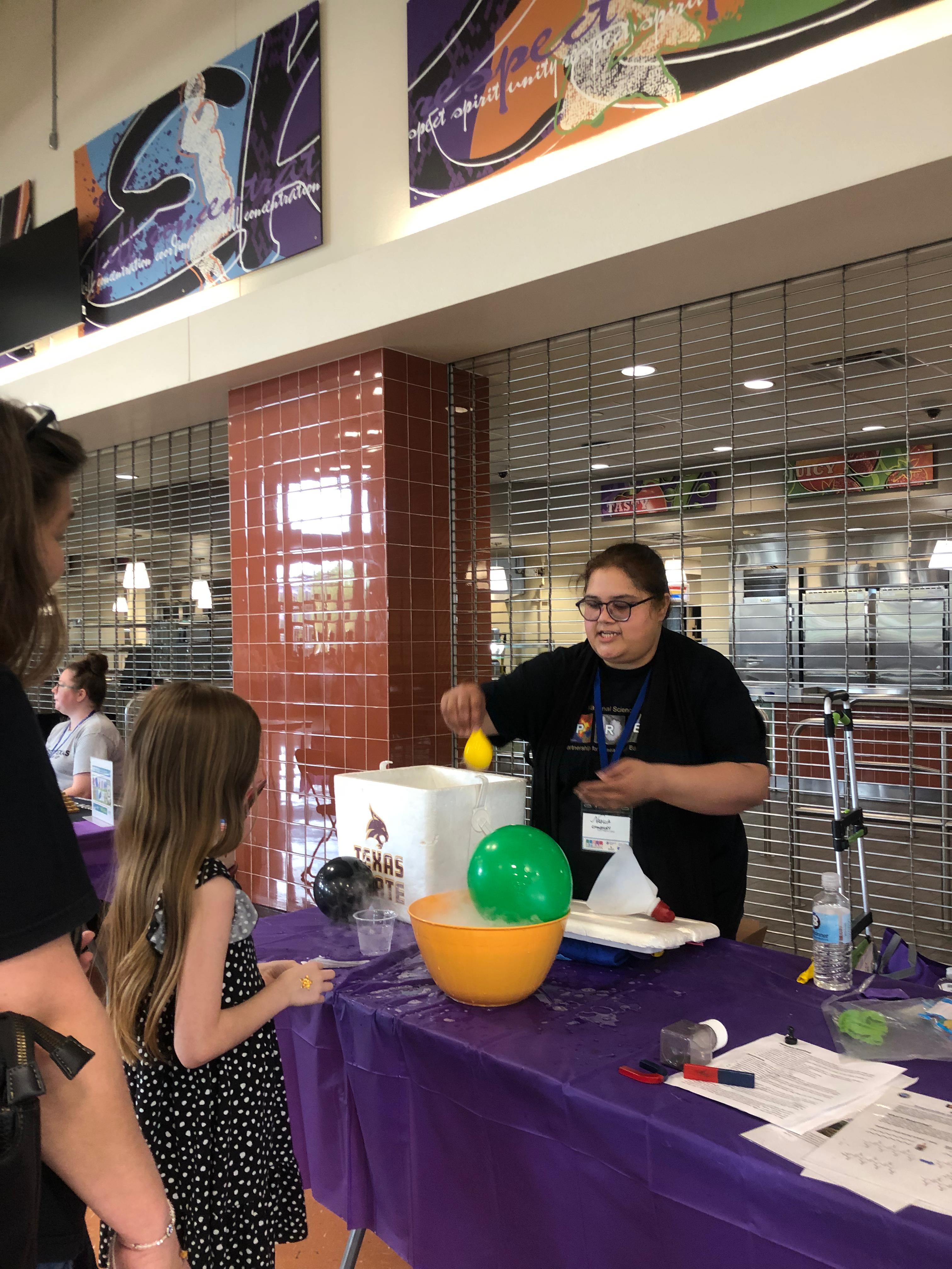 PREM volunteer showcasing STEM Demo