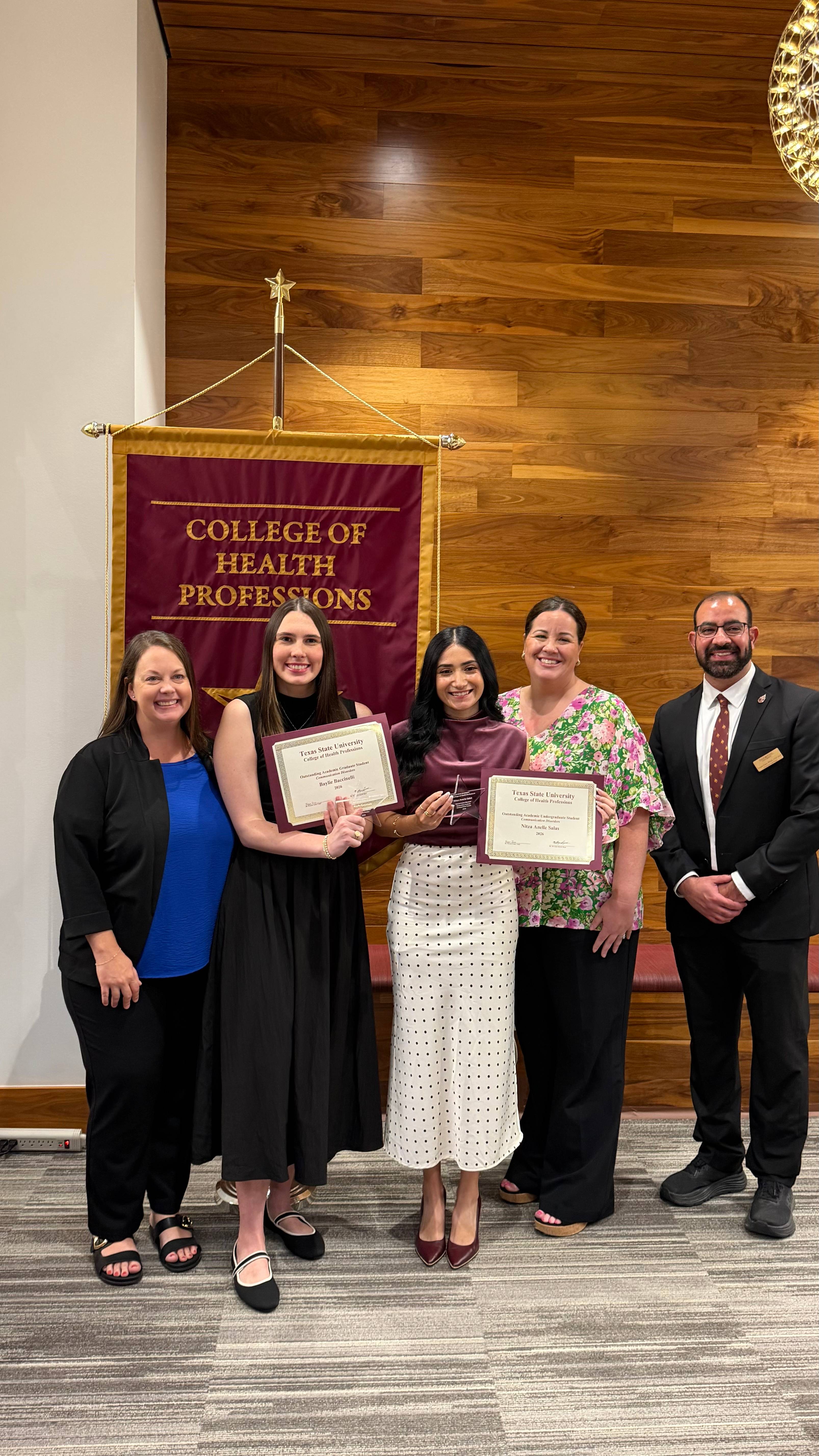 Ms. Baccinelli and Ms. Salas standing next to CDIS faculty members