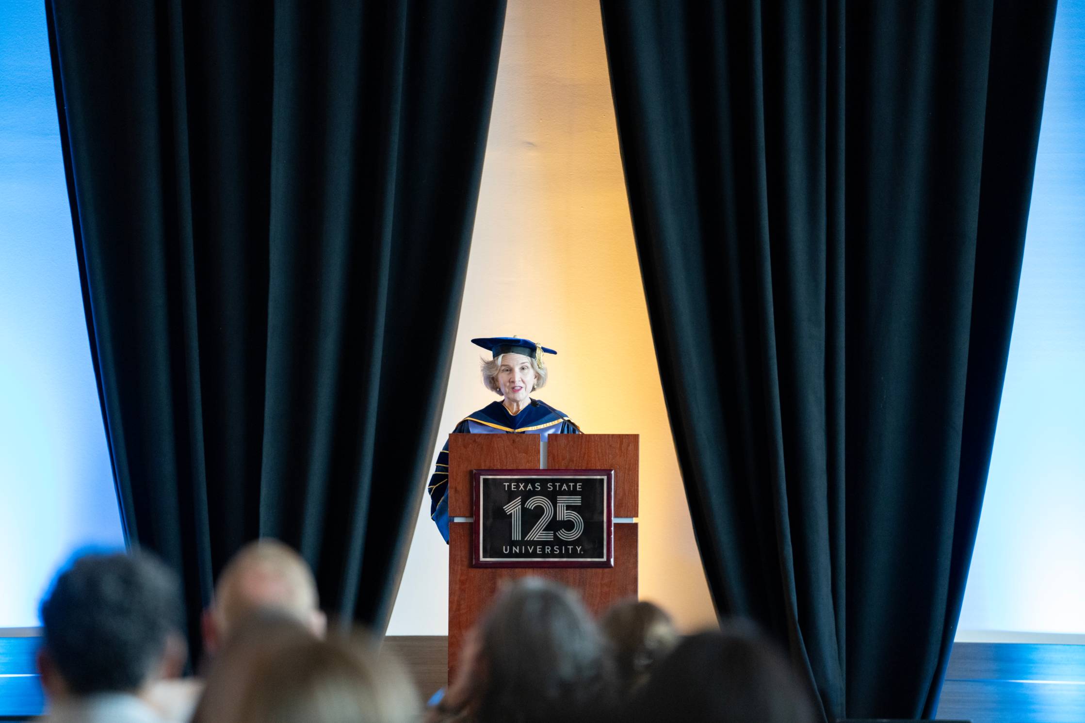 dean galloway gives speech behind podium 