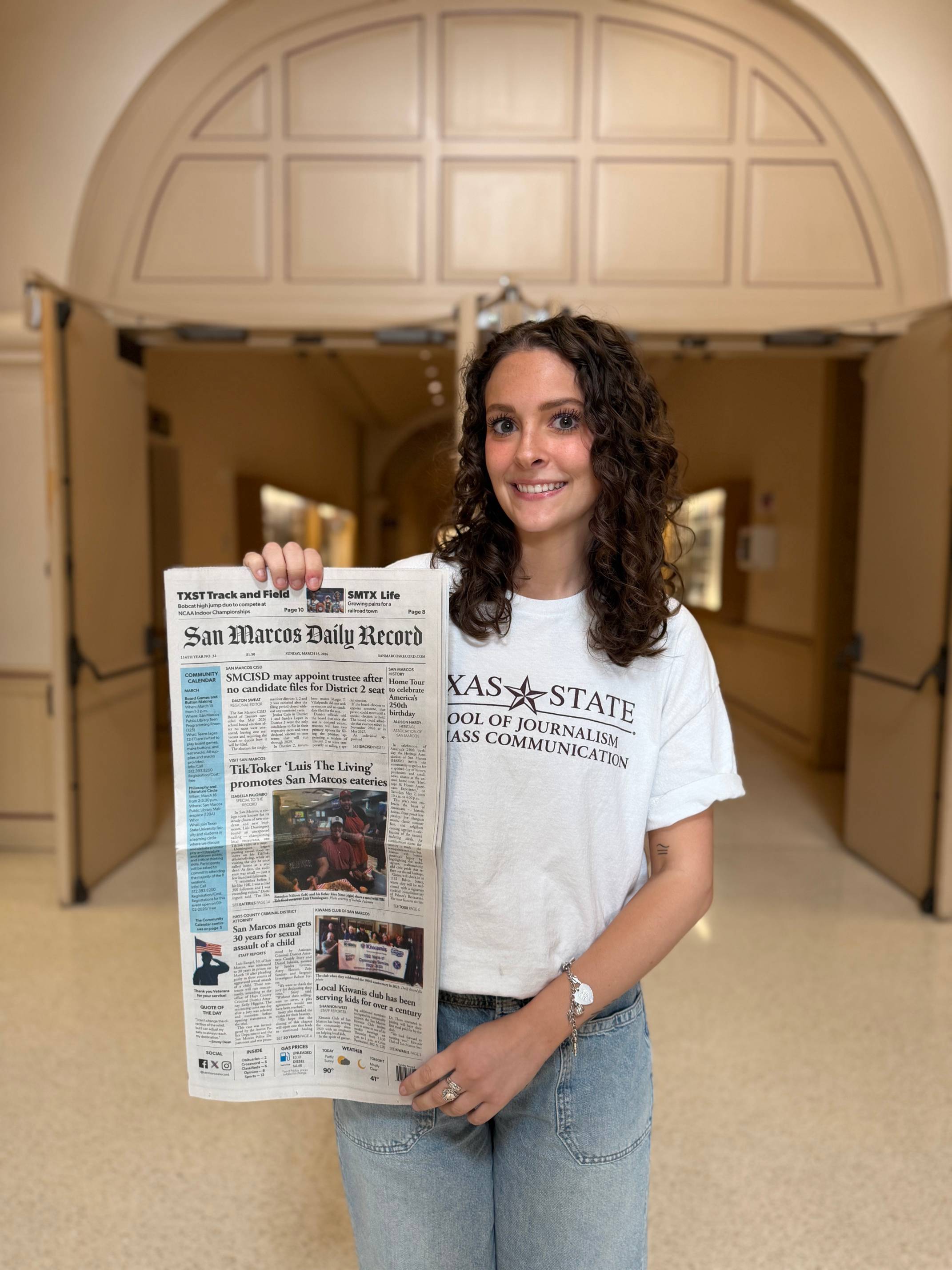 Isabella Palombo held her newspaper featuring her articles.