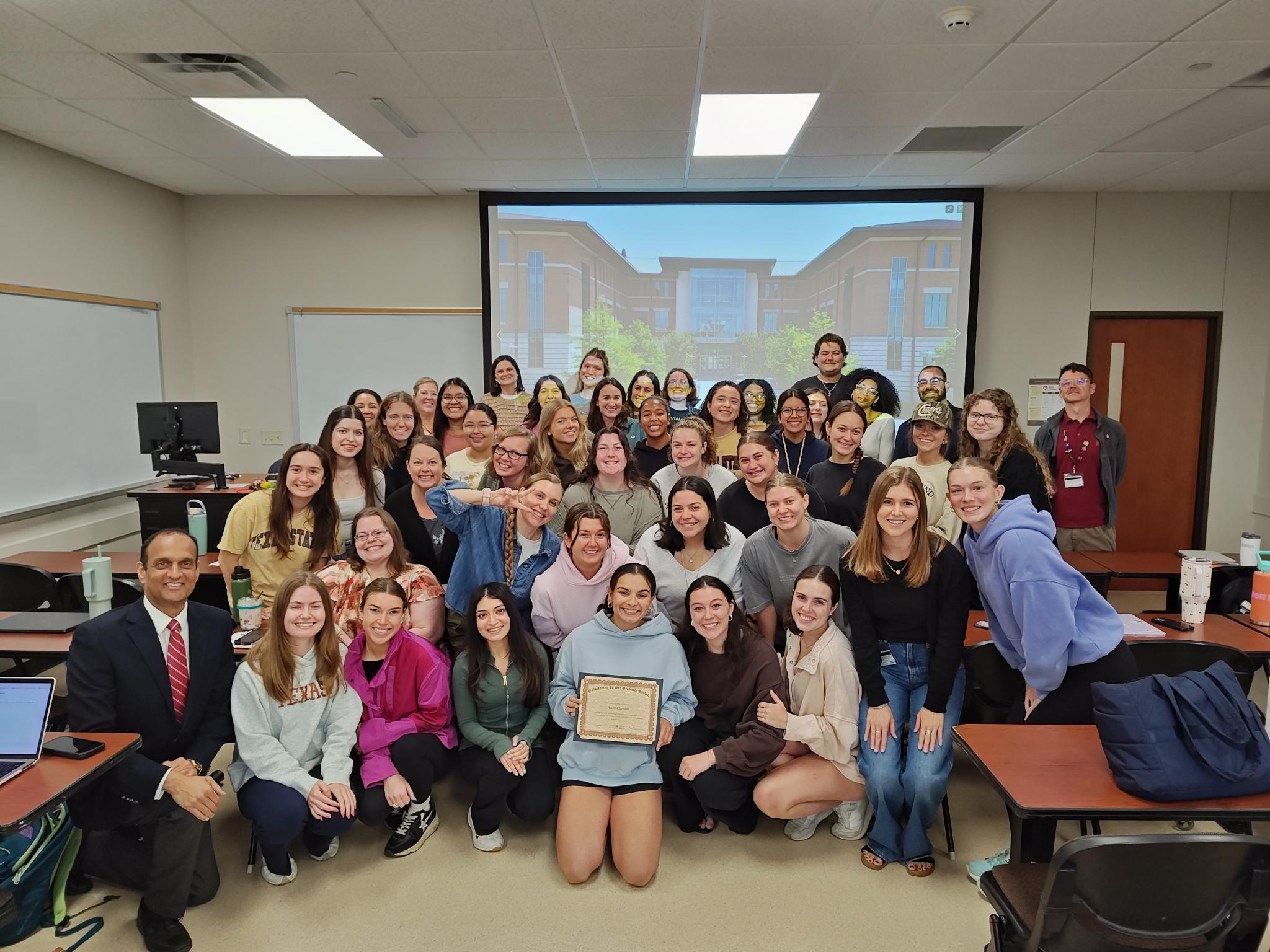 Group picture of the 1st Year Graduate students class and their professors.