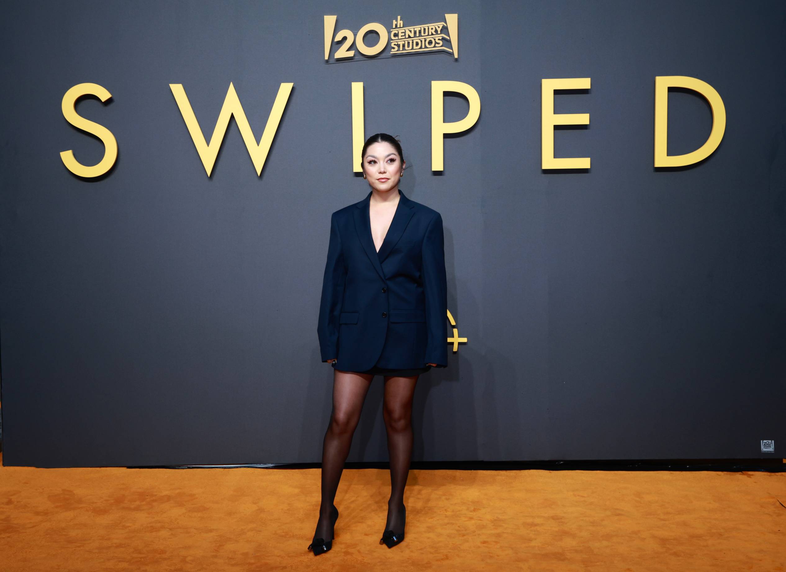 anna yi puig poses on red carpet