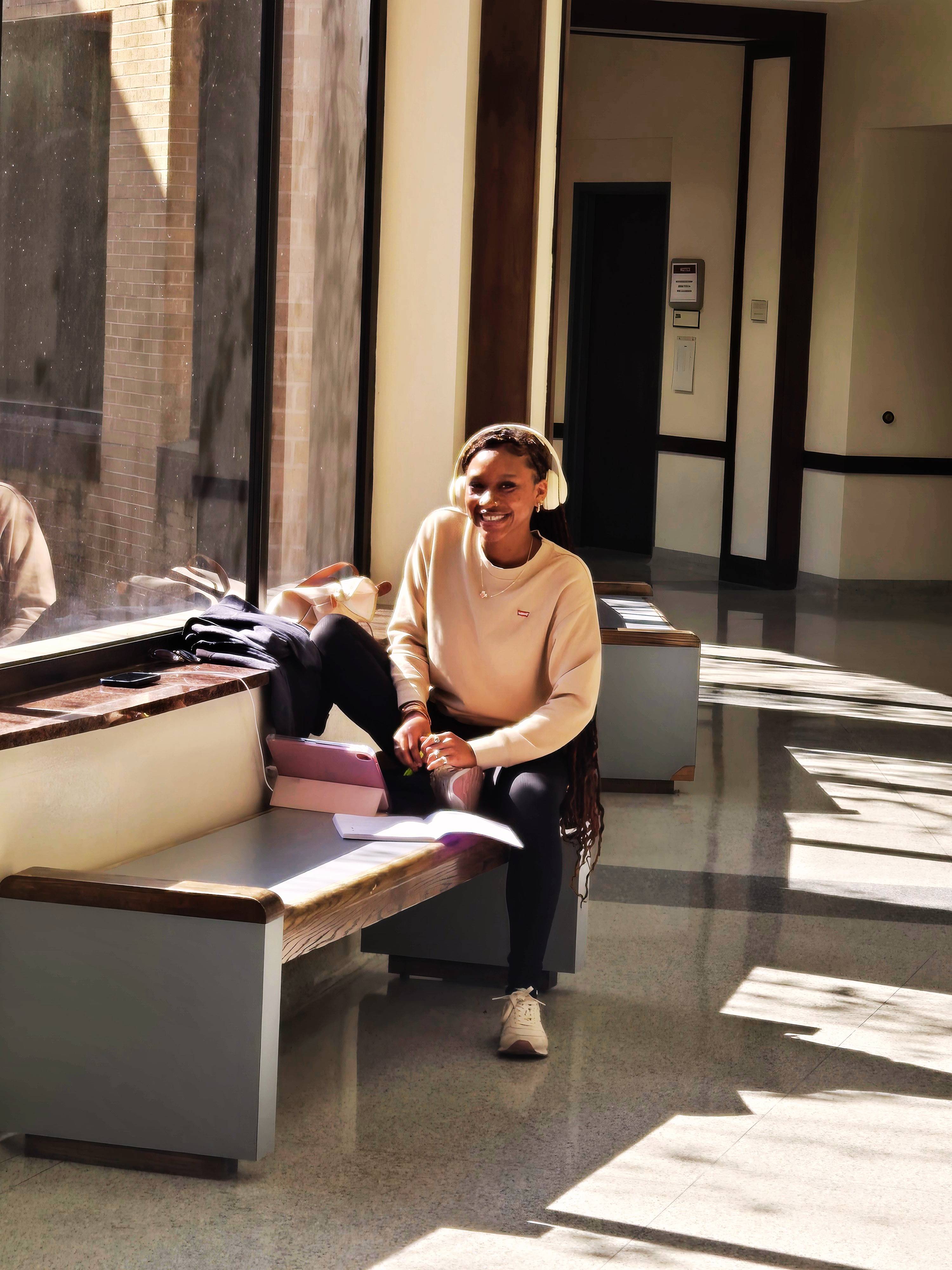 Student studying in enc by window