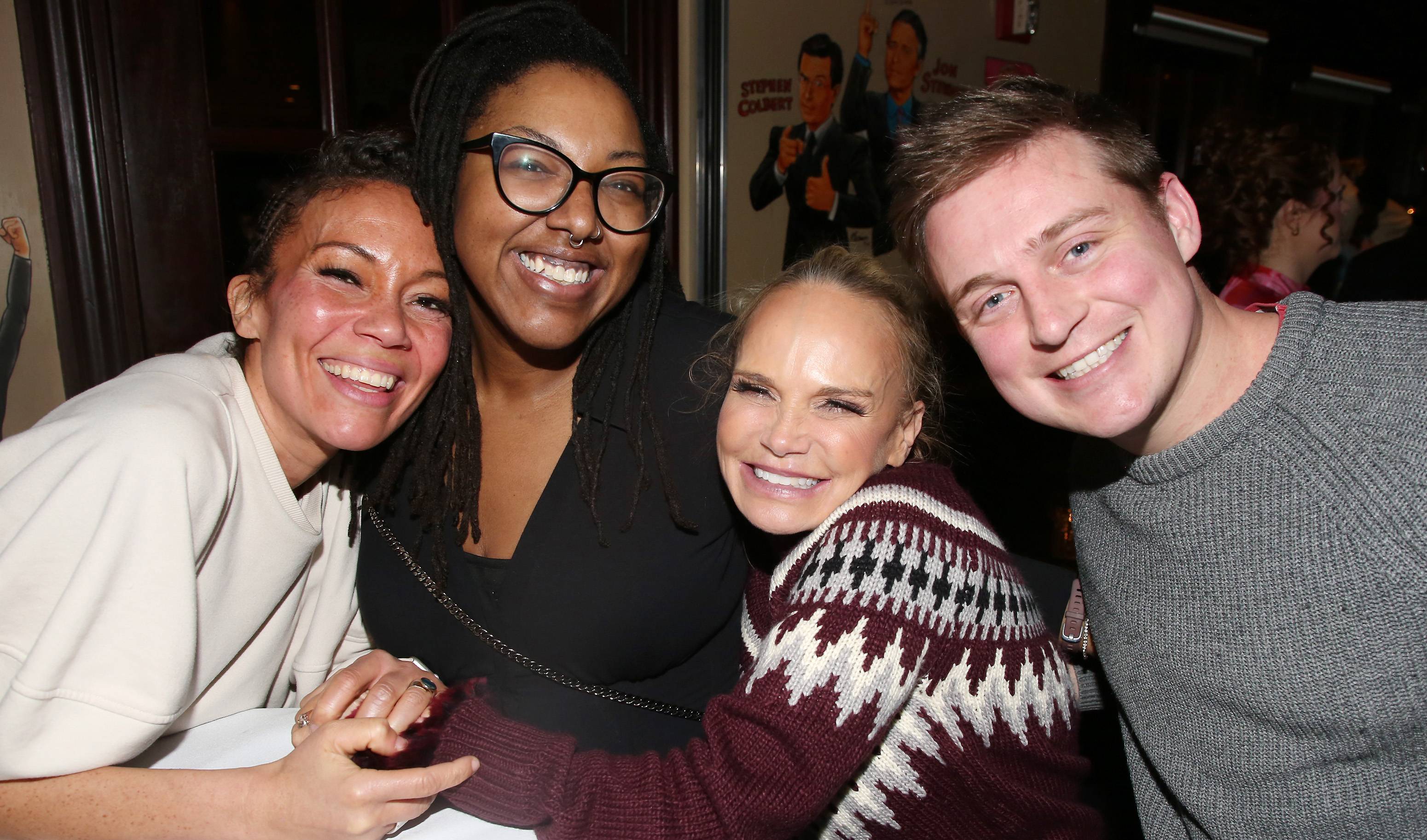 jake young posing for a photo with three women