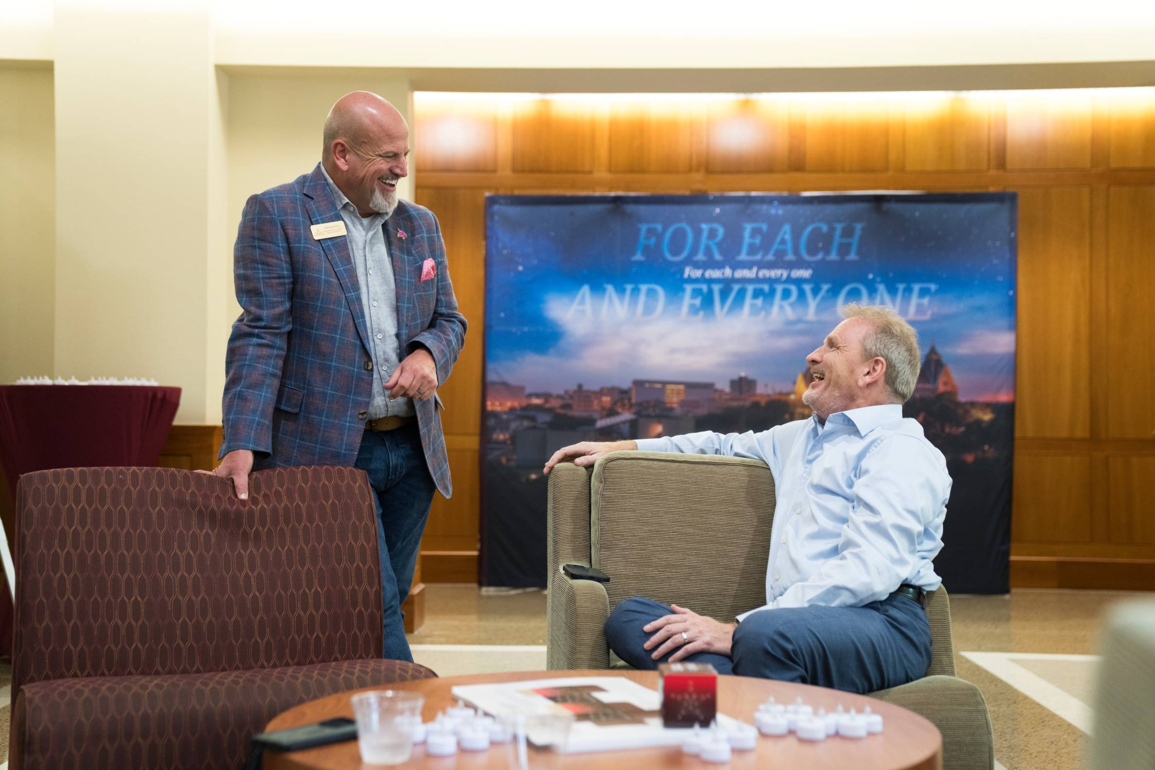 Two men chatting.