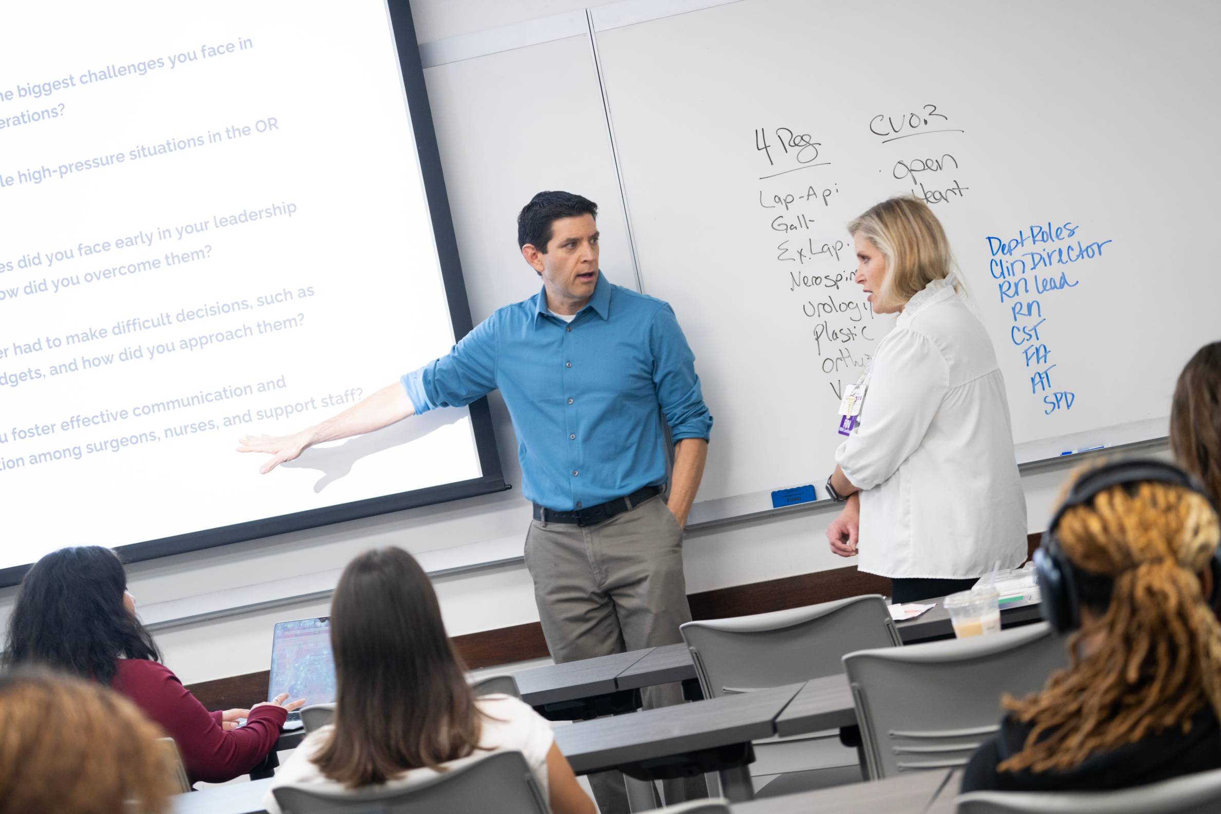 Stephen Garcia giving a lecture with a guest