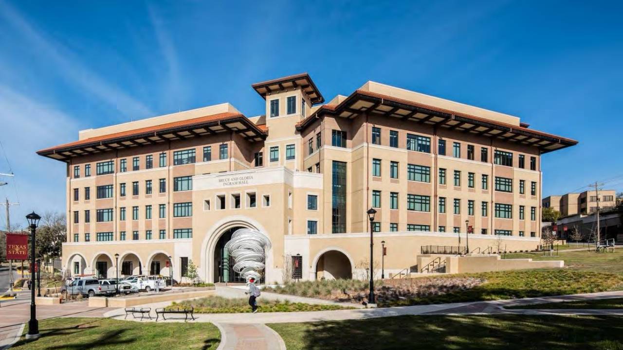 Bruce and Gloria Ingram Hall building on campus with landscaping and paths