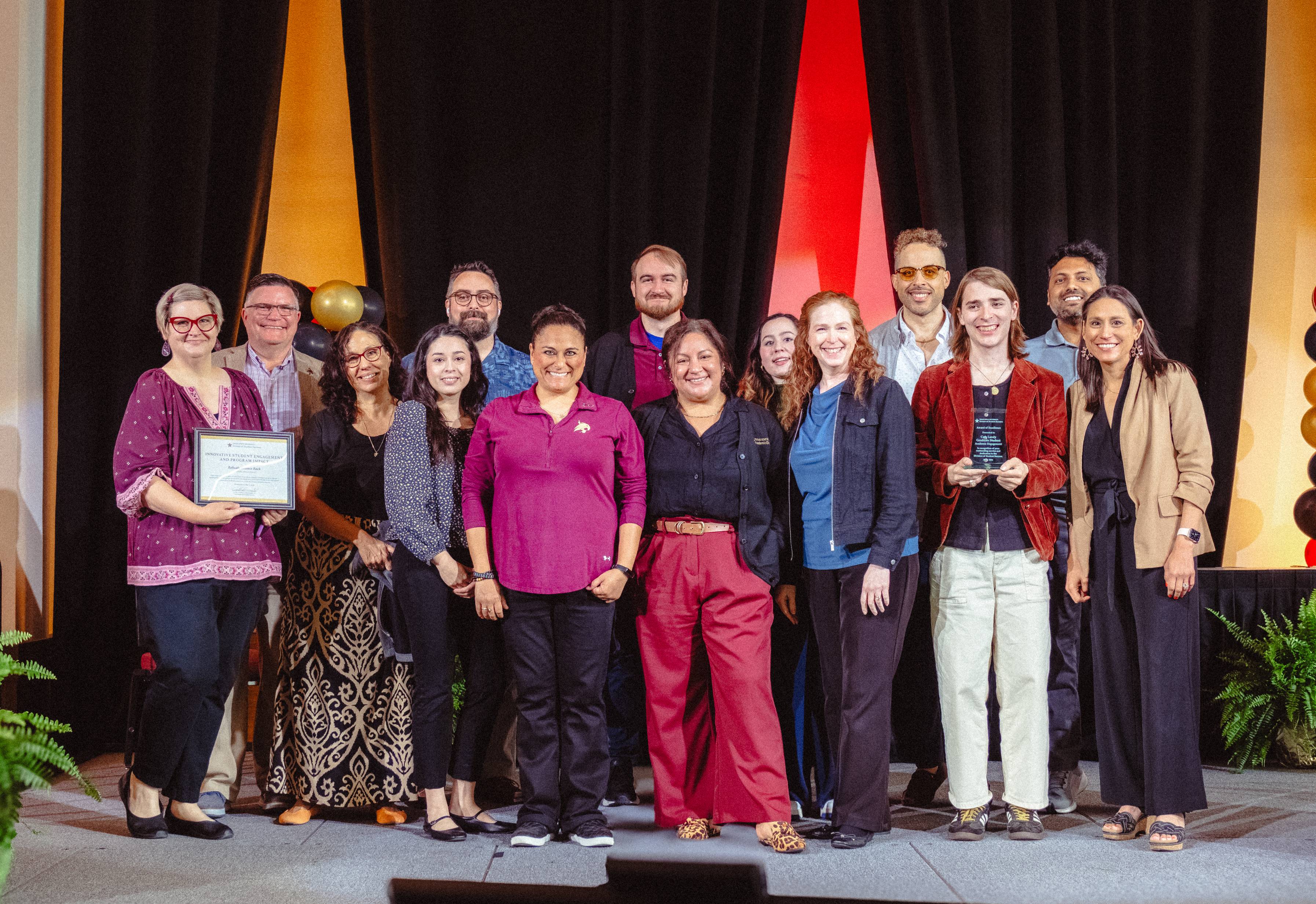 Academic Engagement team poses with their award