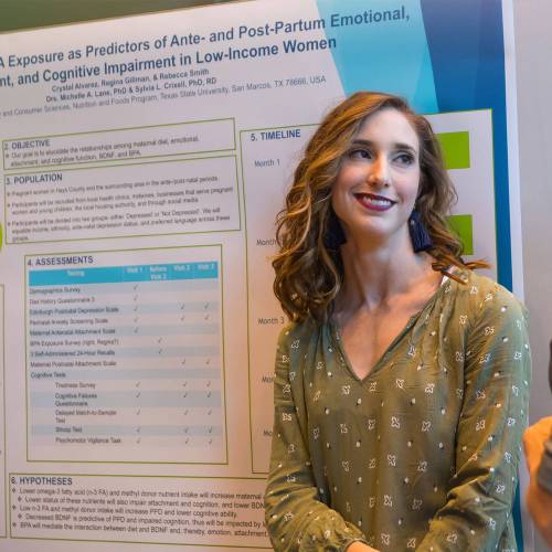 A student presenting at a research conference