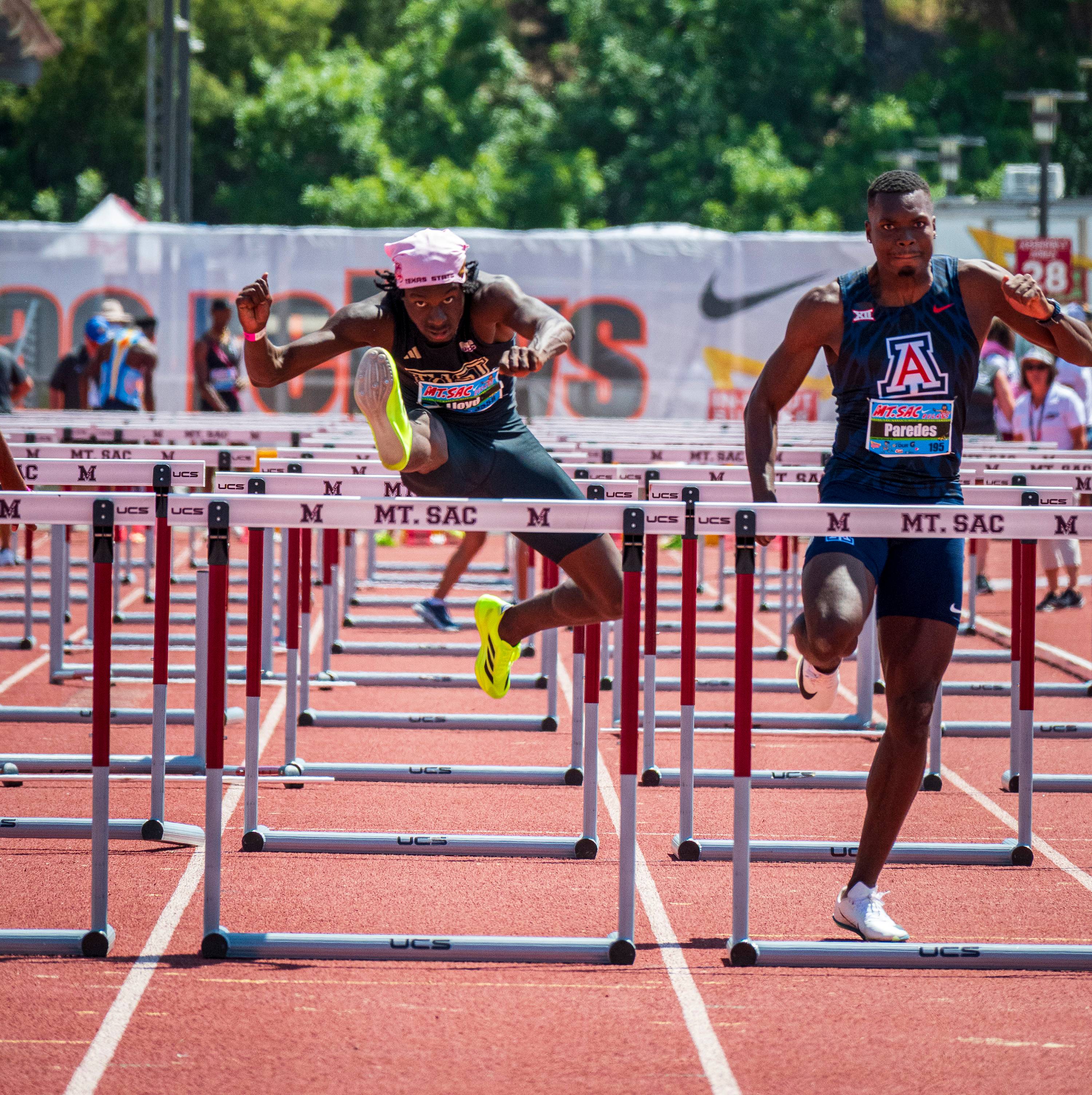 Ja’Shaun Lloyd jumps over a hurdle.