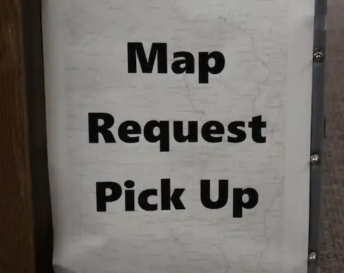 a sign that says "map request pick up"
