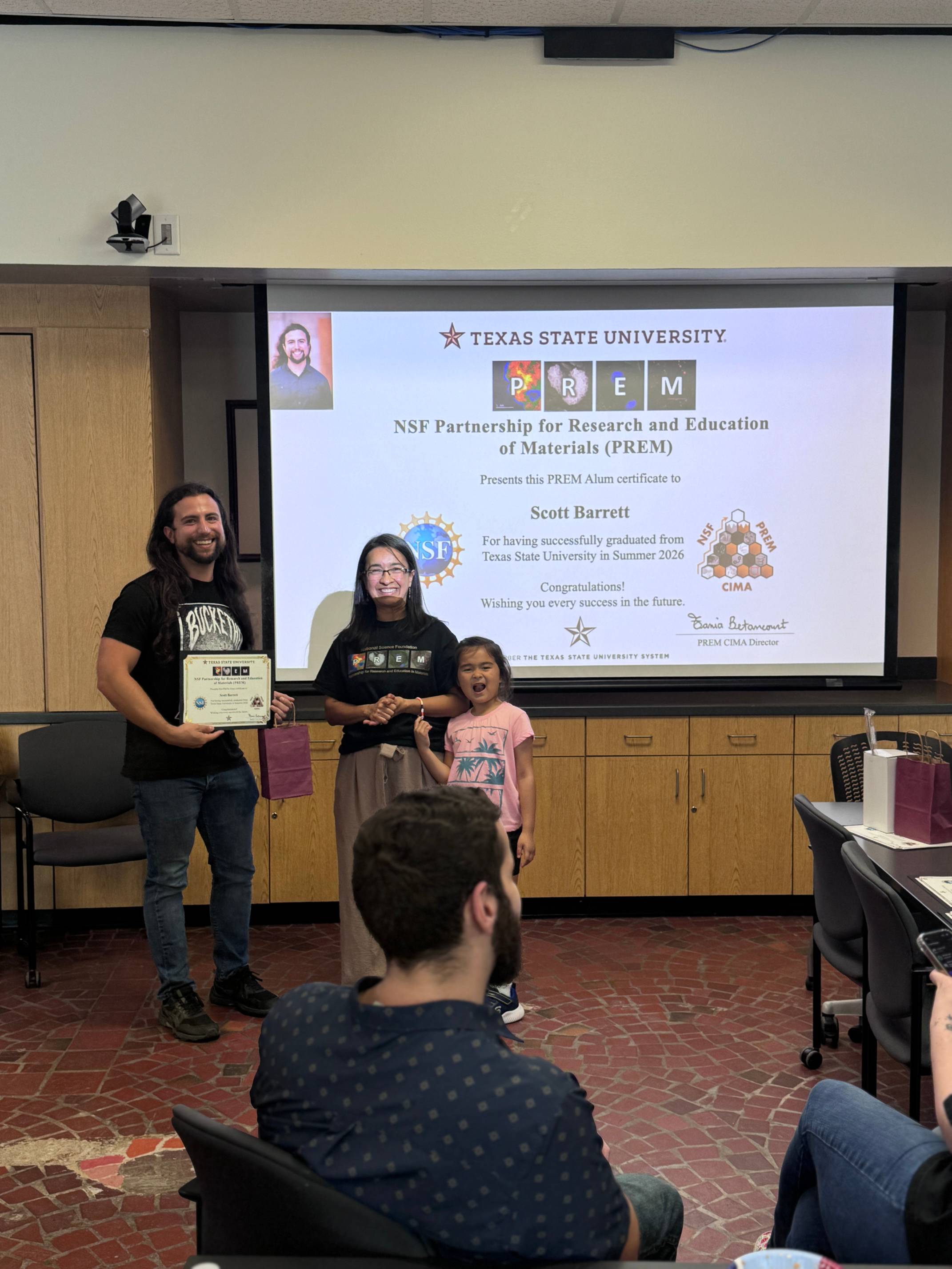 PREM Student receiving graduation award