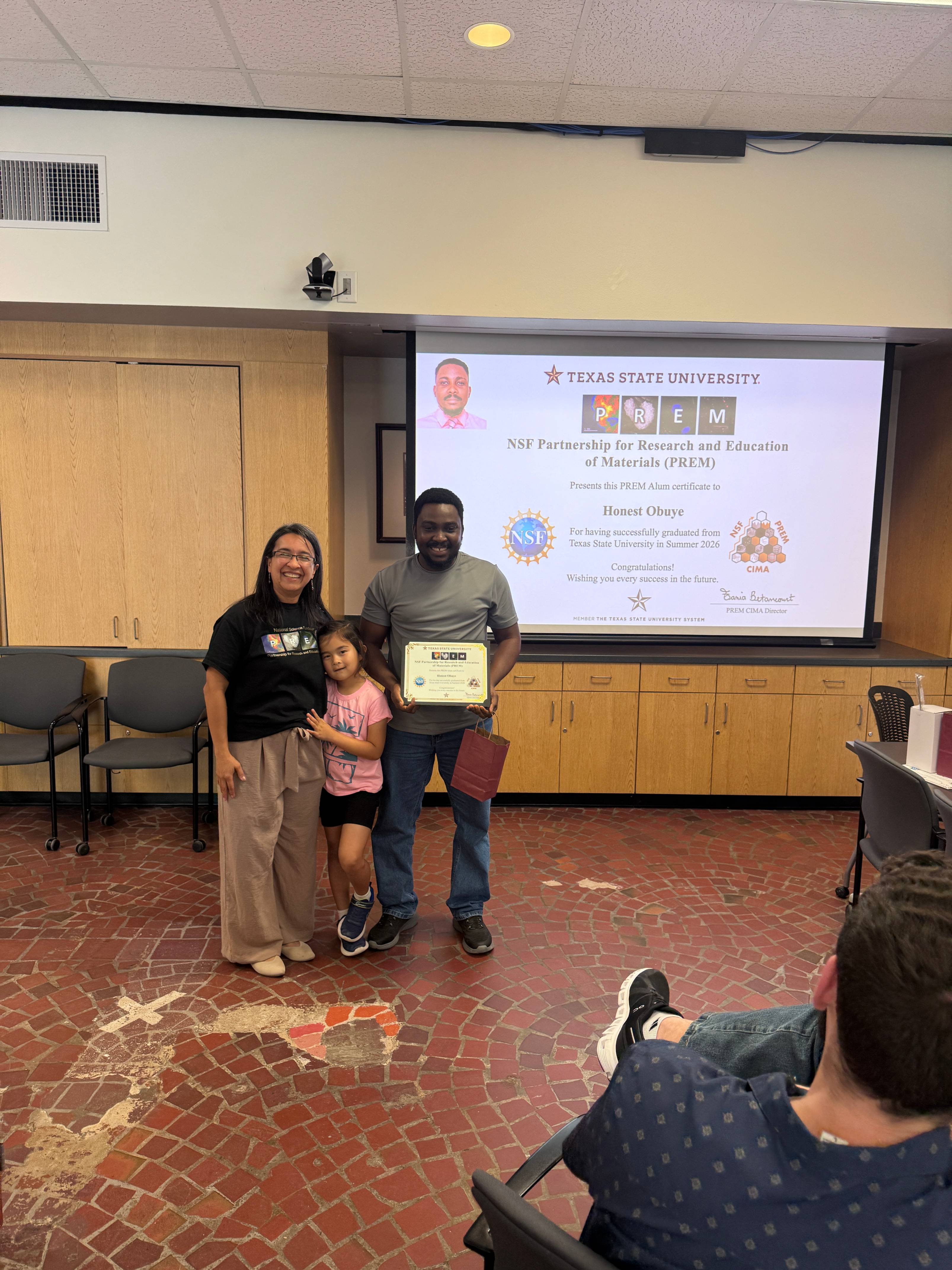 PREM Student receiving graduation award