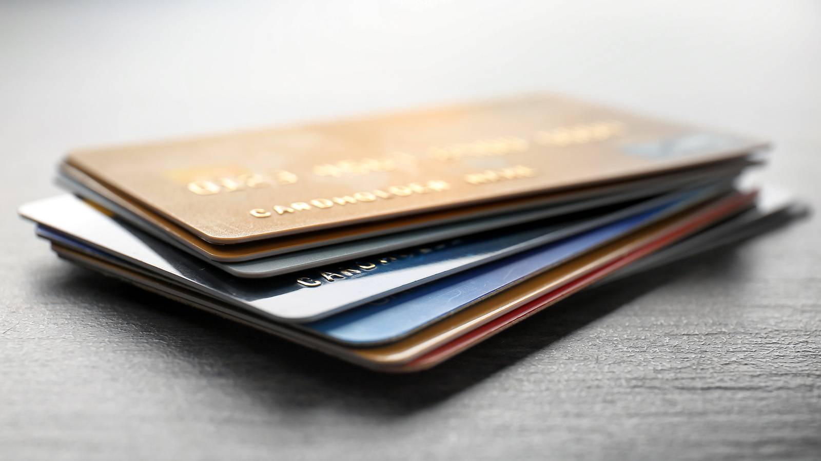stack of credit cards on table