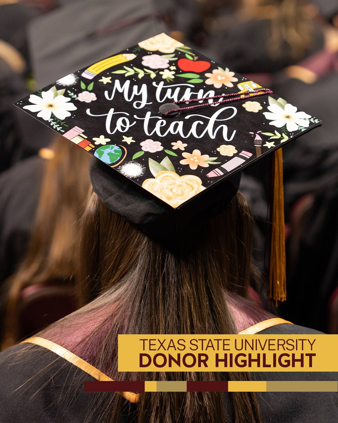 Photo of a student at commencement wearing graduation cap decorated with text reading "my turn to teach"