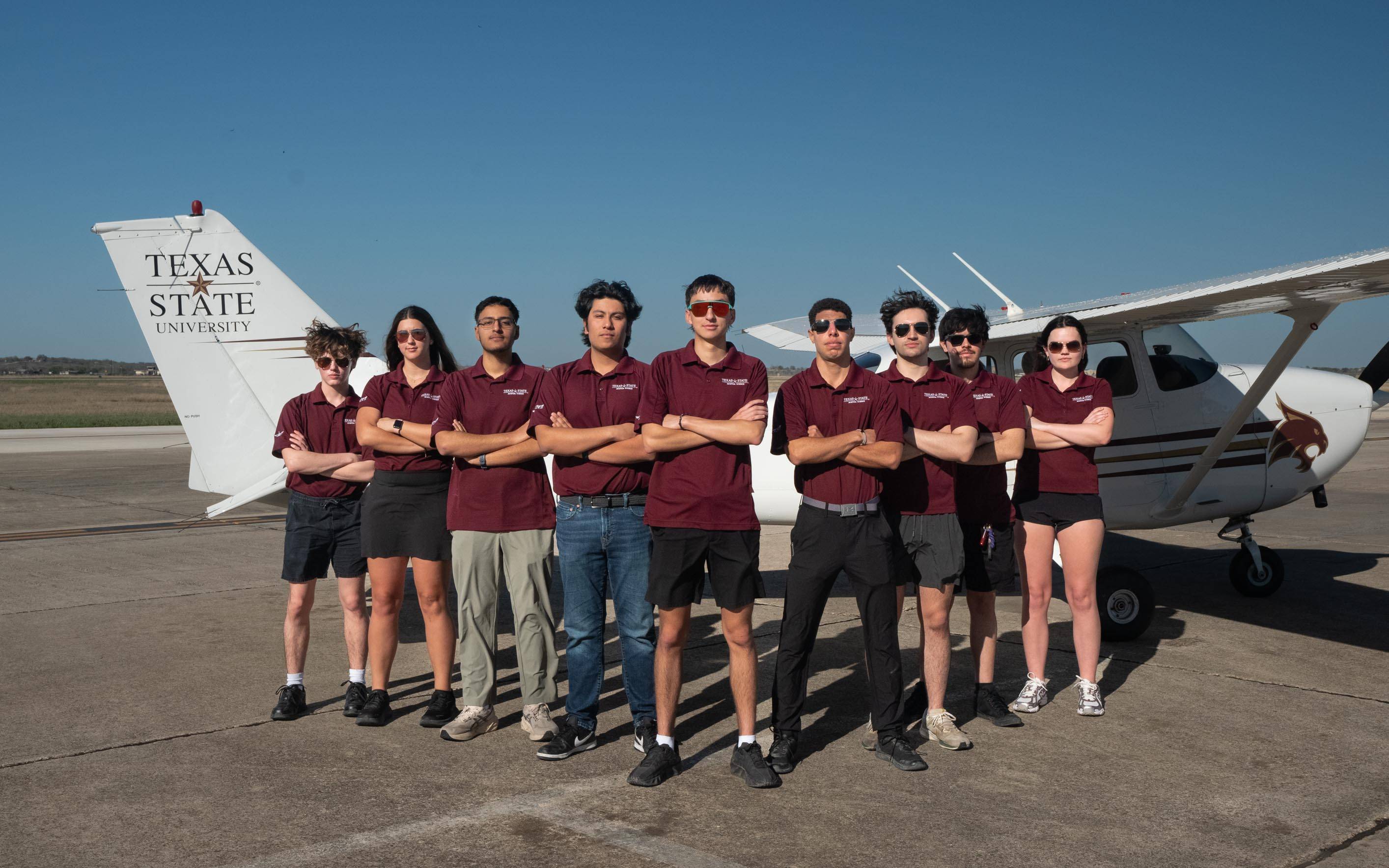 photo of texas state university aviation students at airport