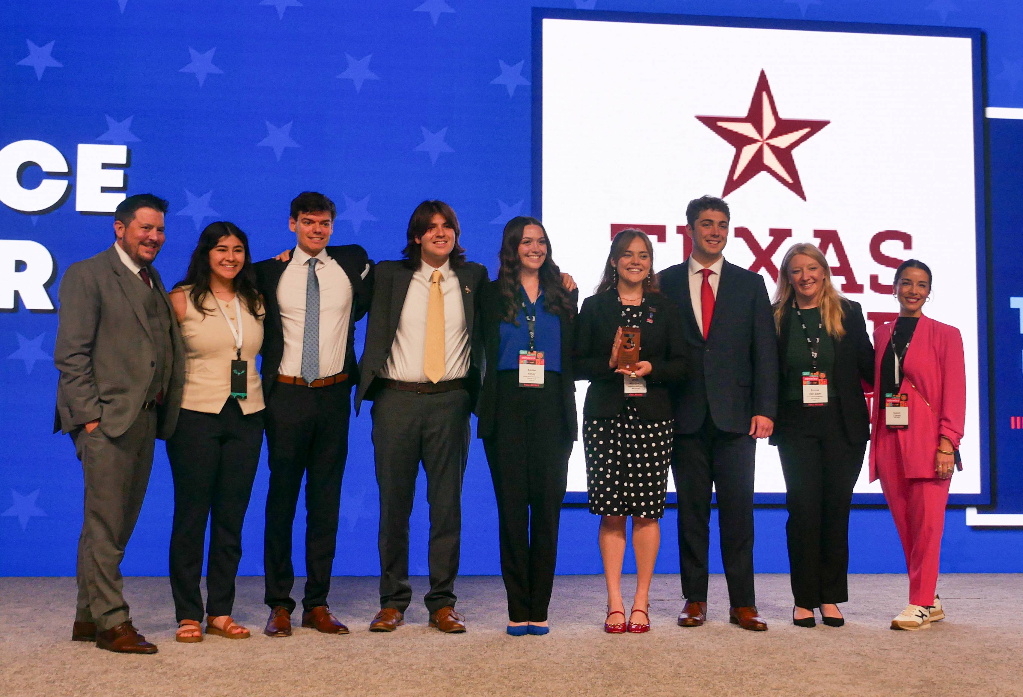 The Texas State NSAC team student representatives , faculty advisors Dr. Mike Devlin and Cimin Cohen, pose after receiving award.