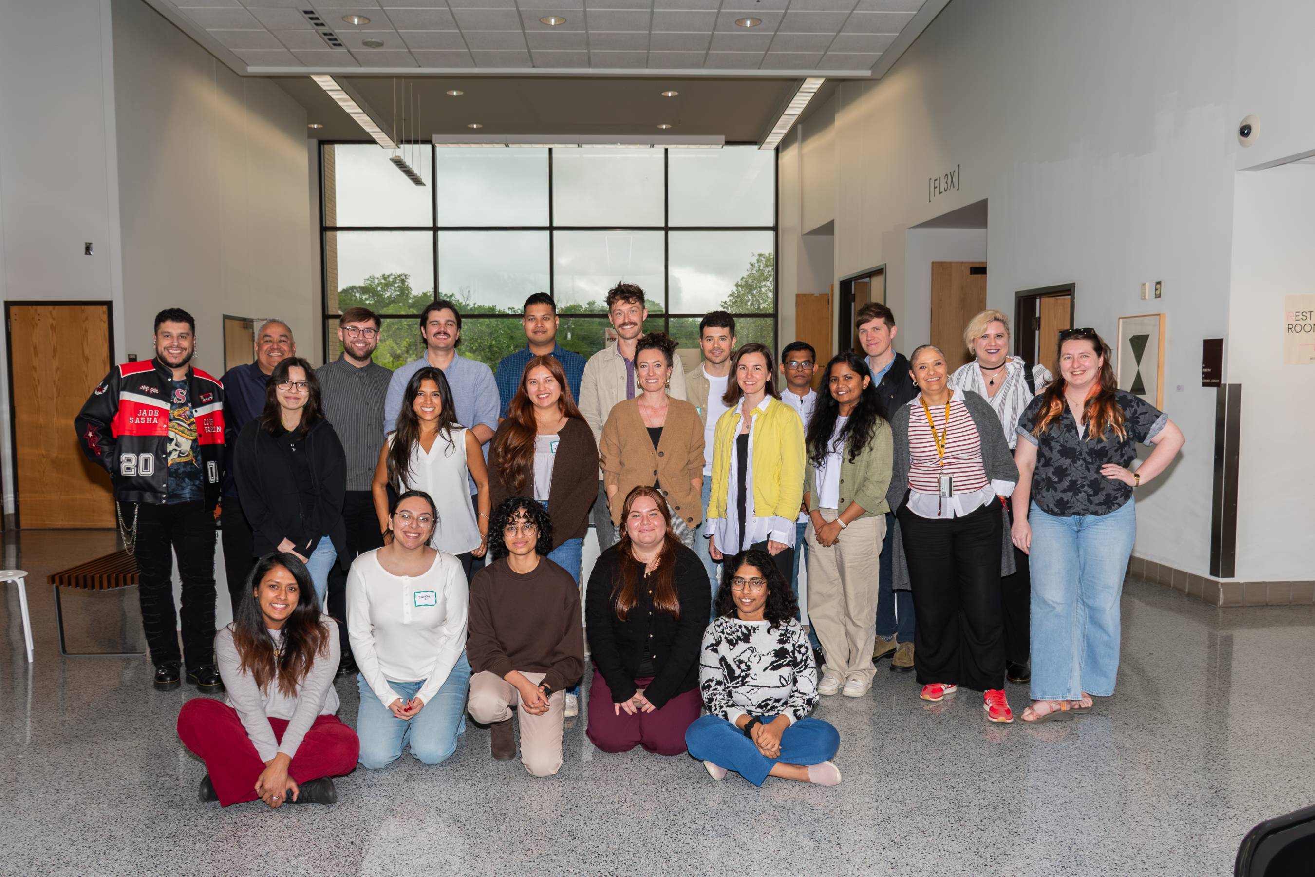 Guest designers and students pose for a group photo. 