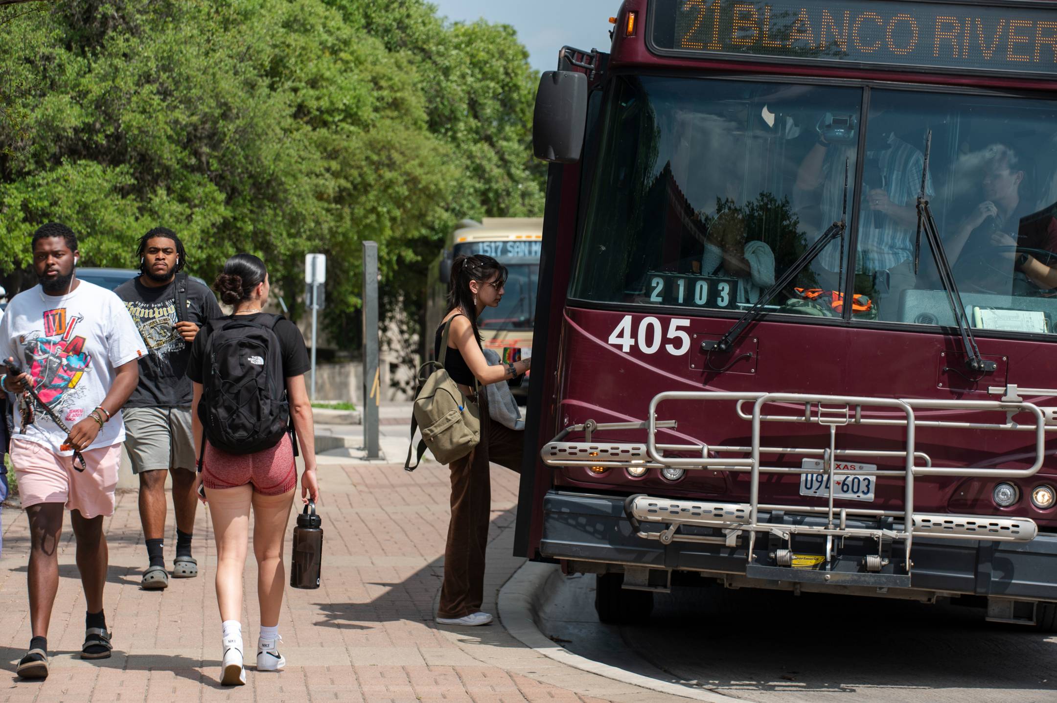 student getting on bobcat shuttle 