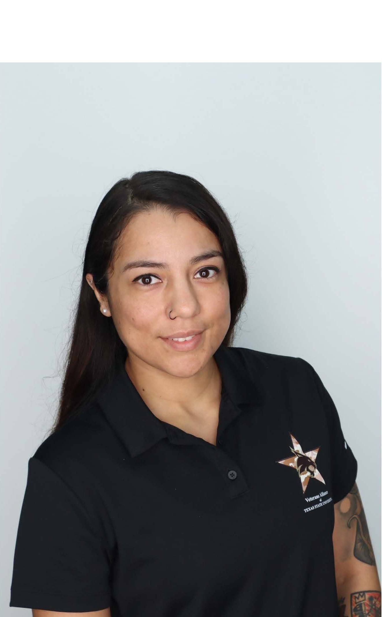 Photo of VATS President Alyssa Hernandez -she is wearing a black polo with the veterans logo