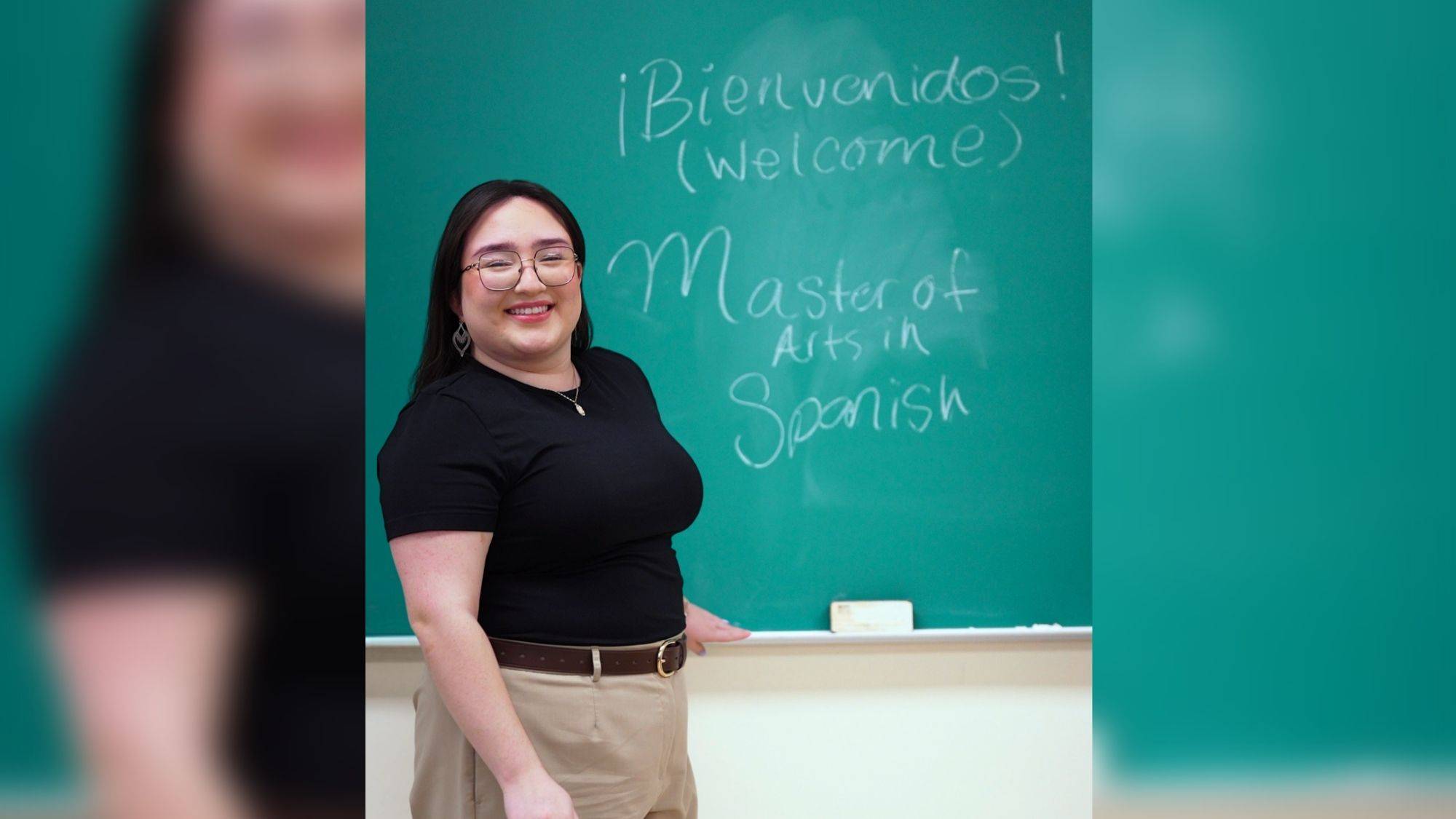 Angela Garcia gives an interview about her graduate program from a classroom