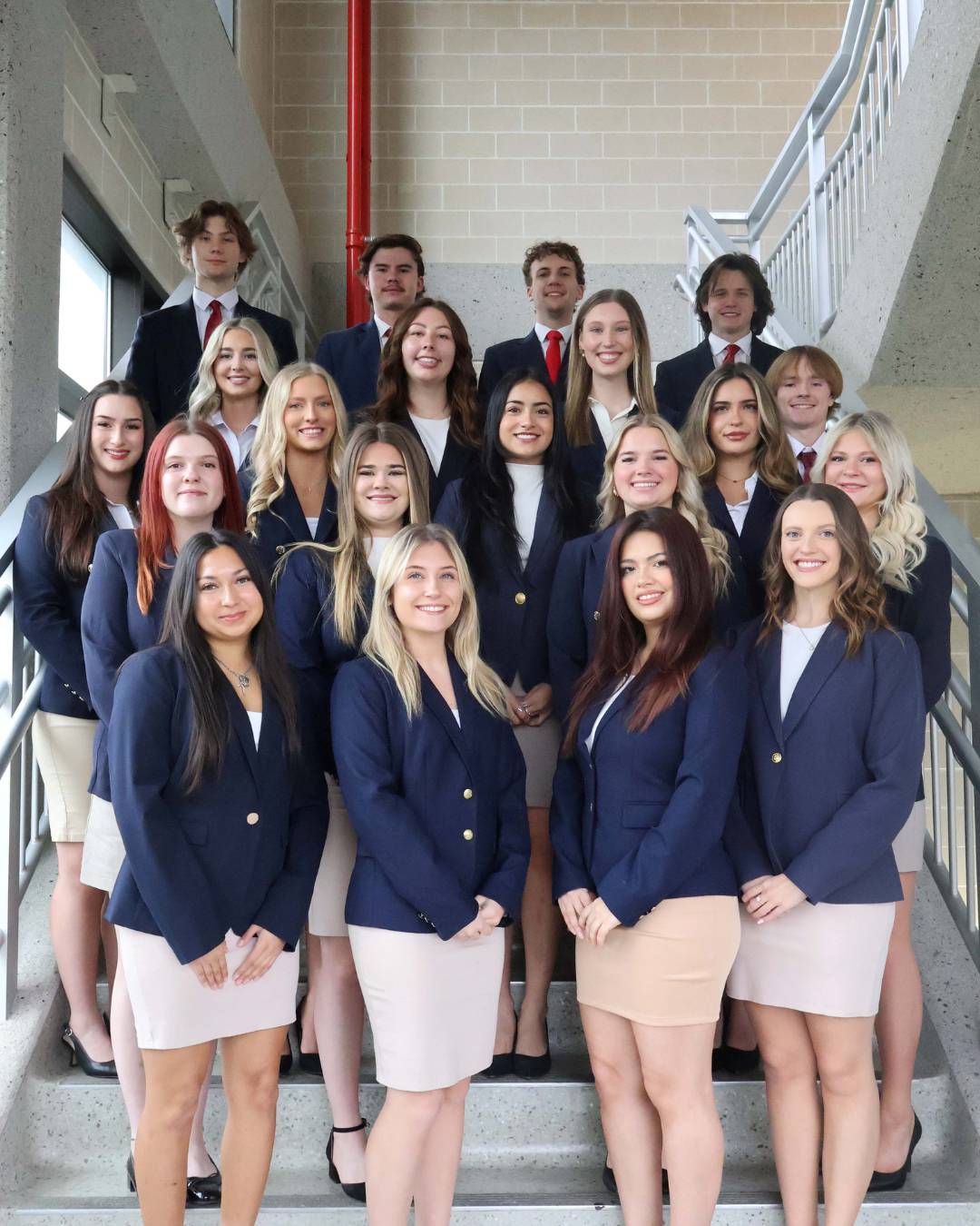 sales ambassadors on staircase