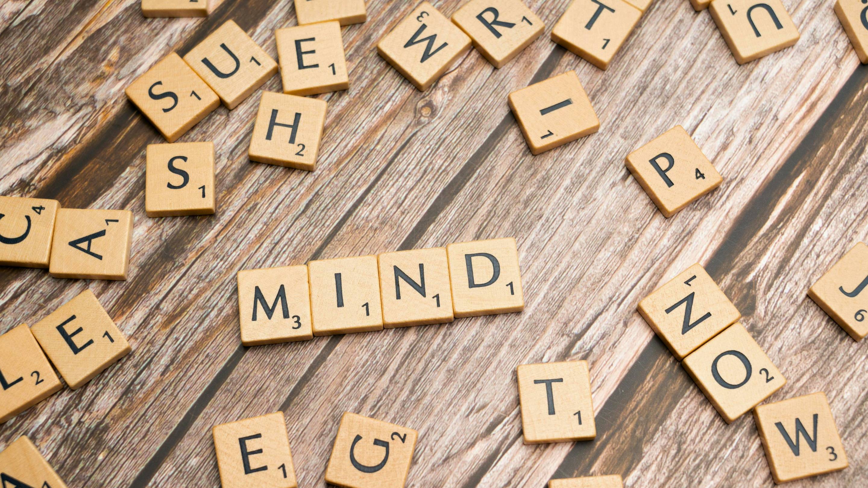 scrabble tiles on wooden table
