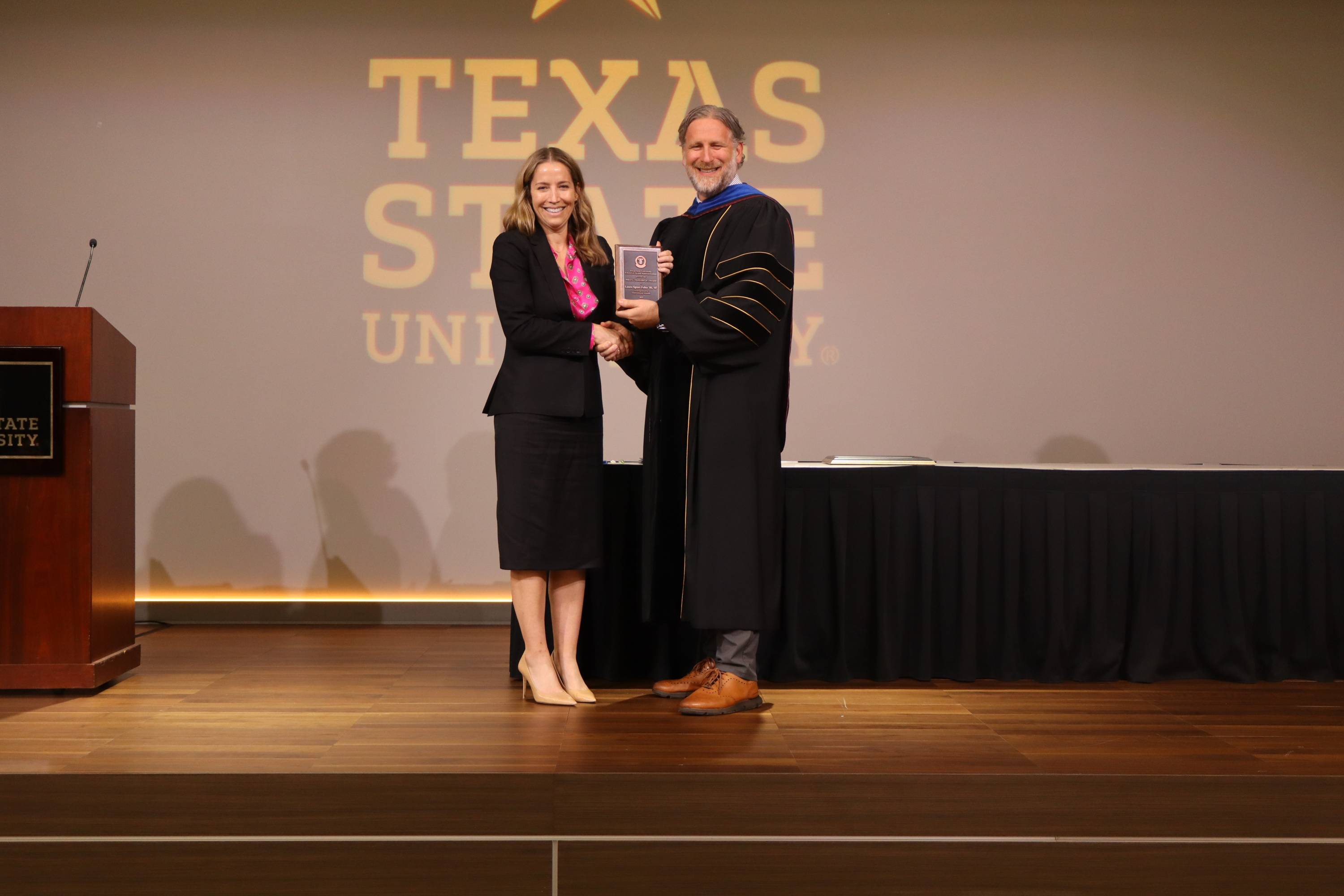 Image of Laura Speer Fohn (graduate of the Bachelor of Healthcare Administration  and Master of Healthcare Administration programs) being presented with the School of Health Administration's 2025 Outstanding Alumni.