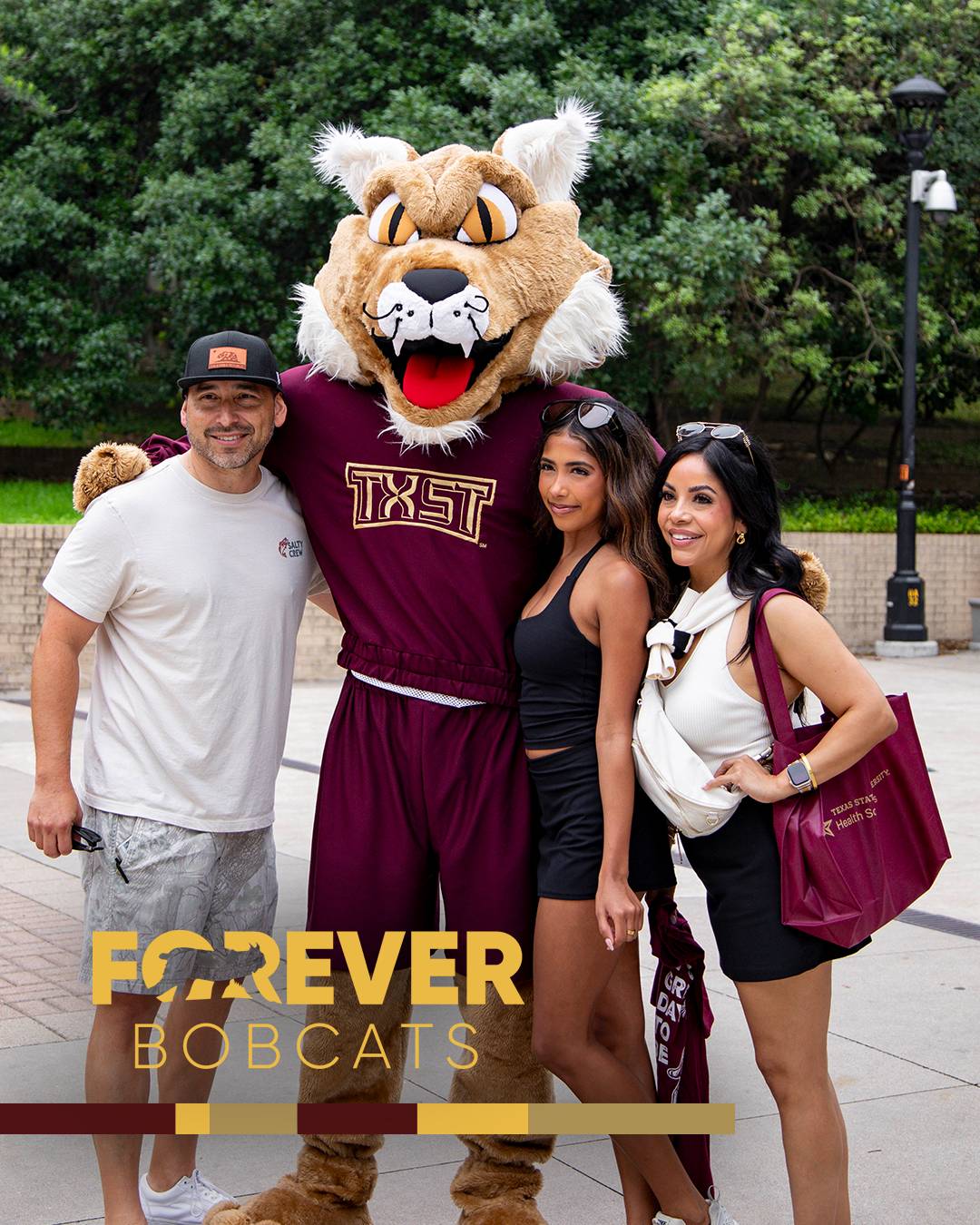 Future Texas State student posing for a photo with her parents and Boko the Bobcat 