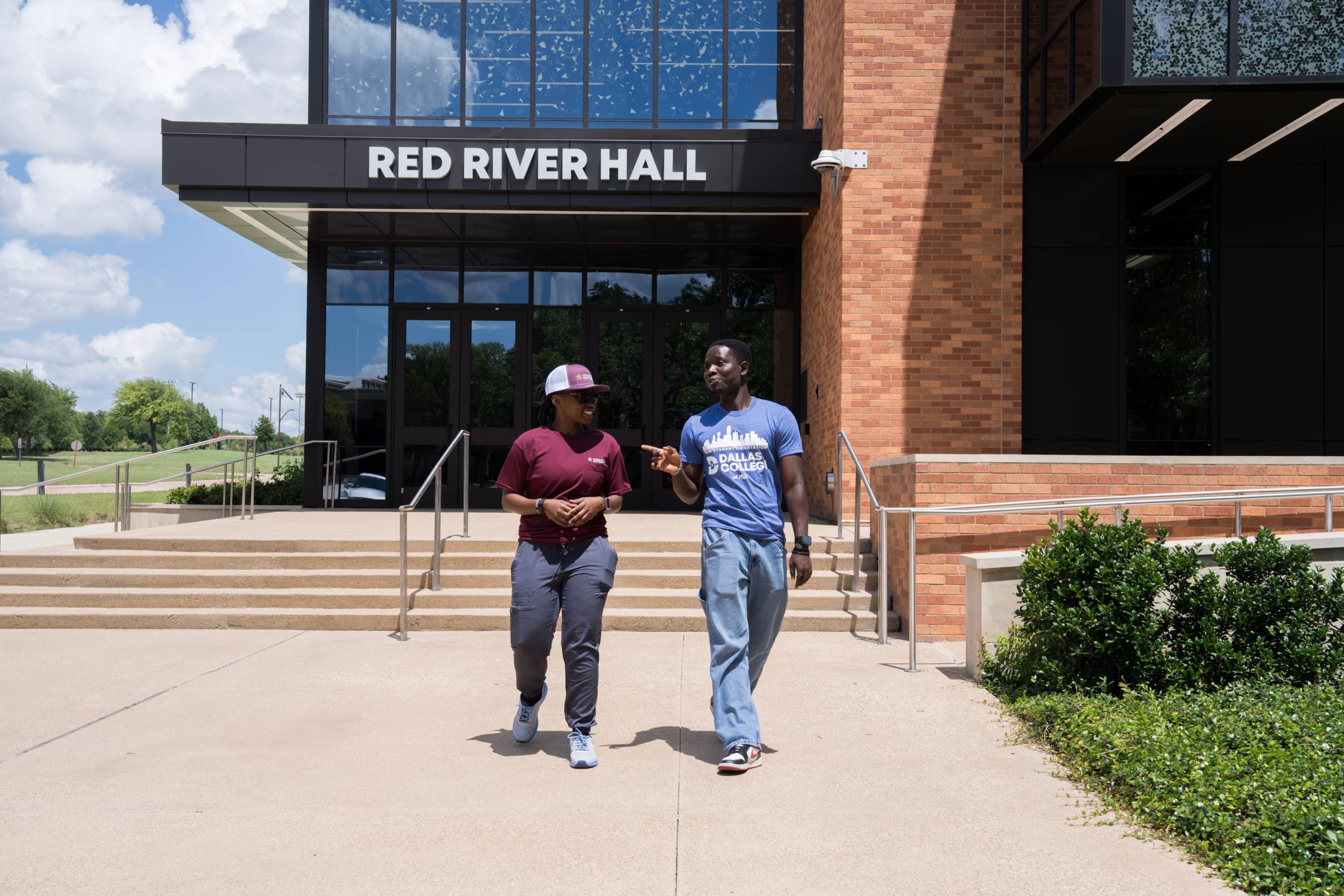two students walk around Dallas College campus