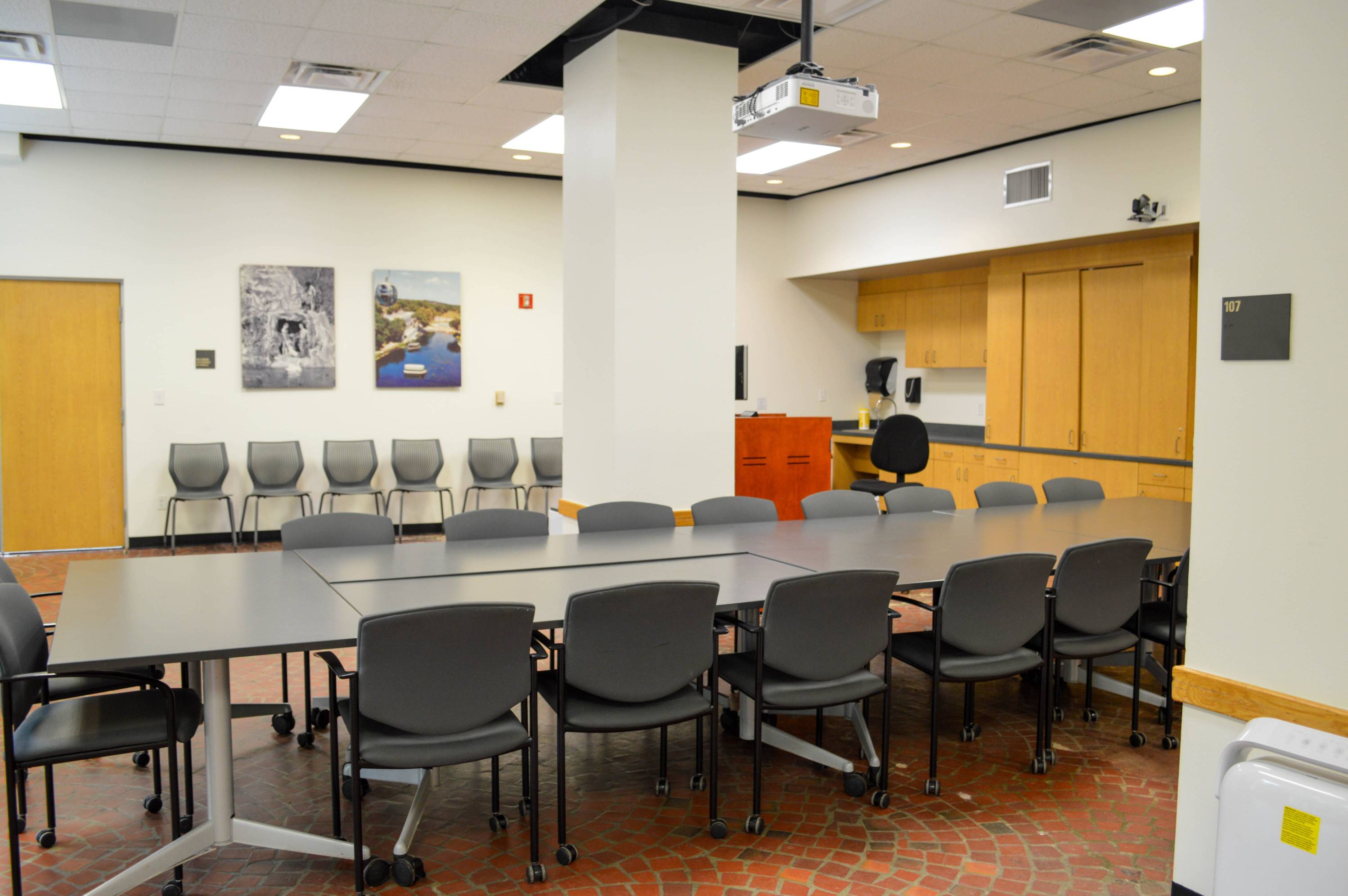 View of table, chairs, and pillar.