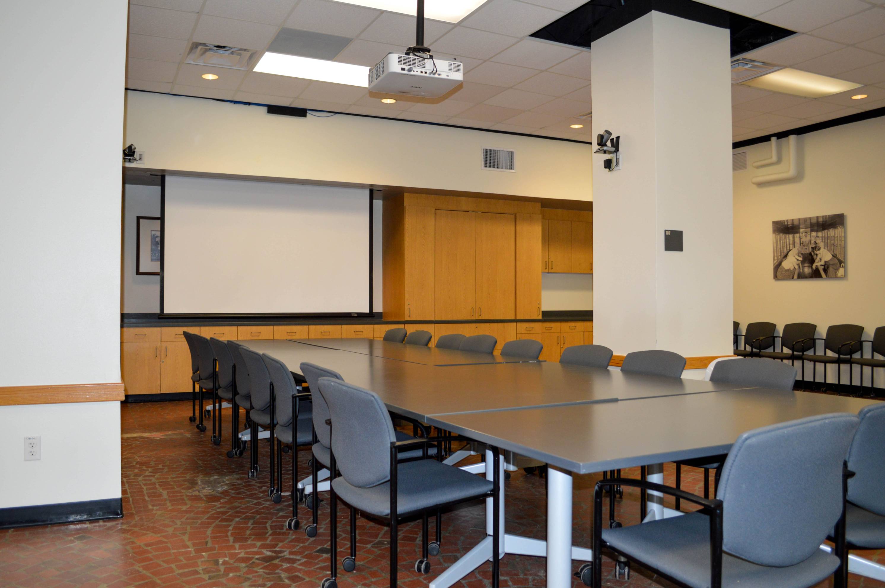 View of projector board, pillar, and table.