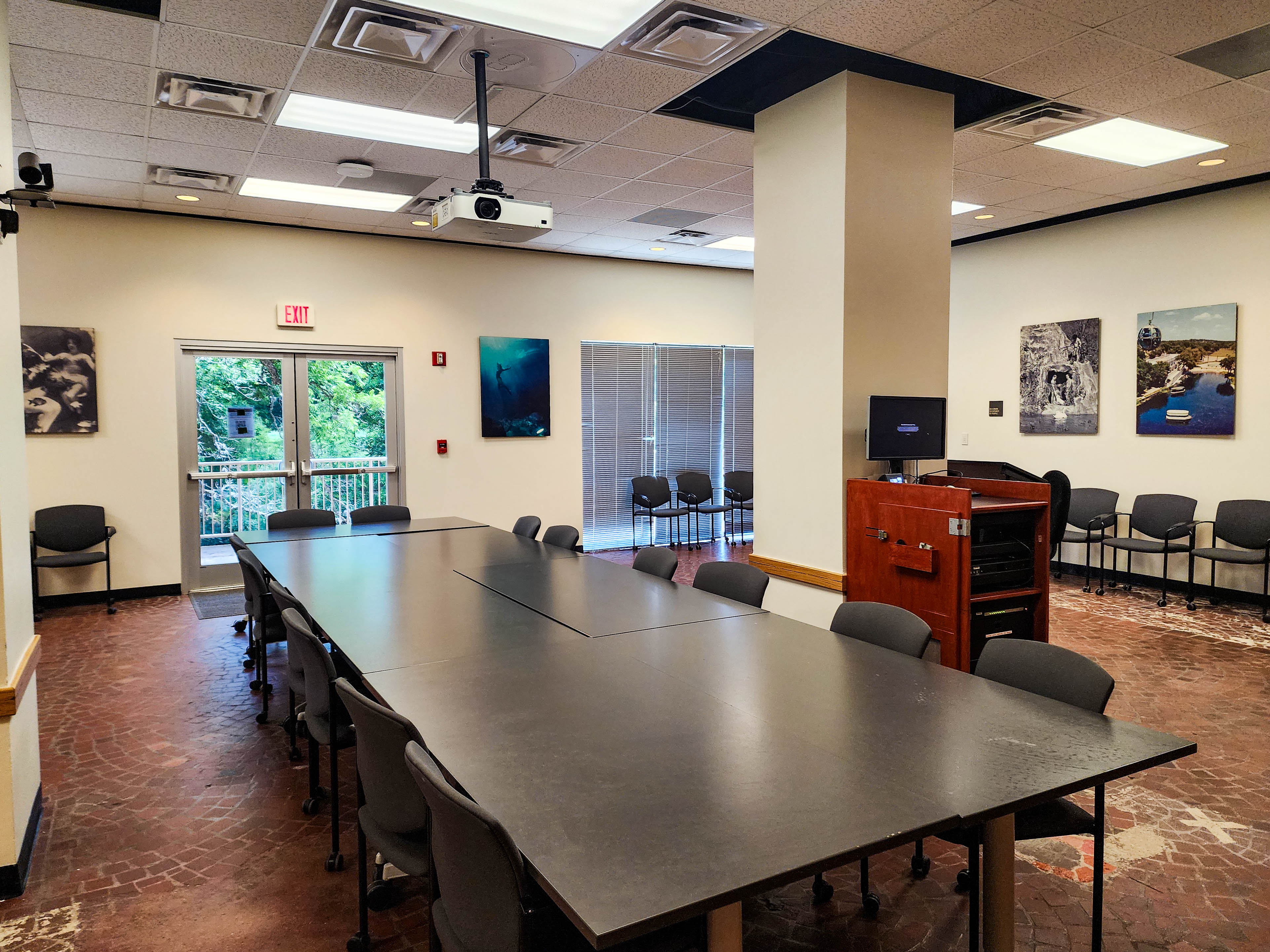 Left view of conference room with table and lights.