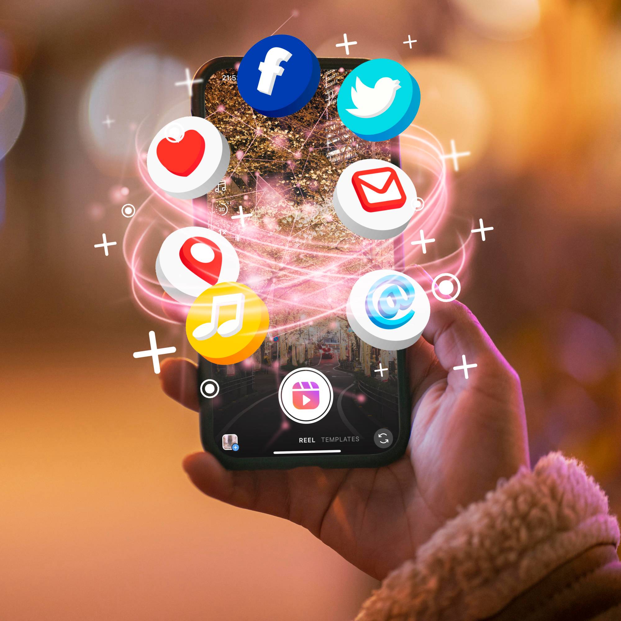 Hand holding a smartphone displaying social media and content creation features, surrounded by floating icons for Facebook, Twitter, email, location, music, and messaging. The image represents social media marketing, digital communication, content creation, audience engagement, and online brand promotion.