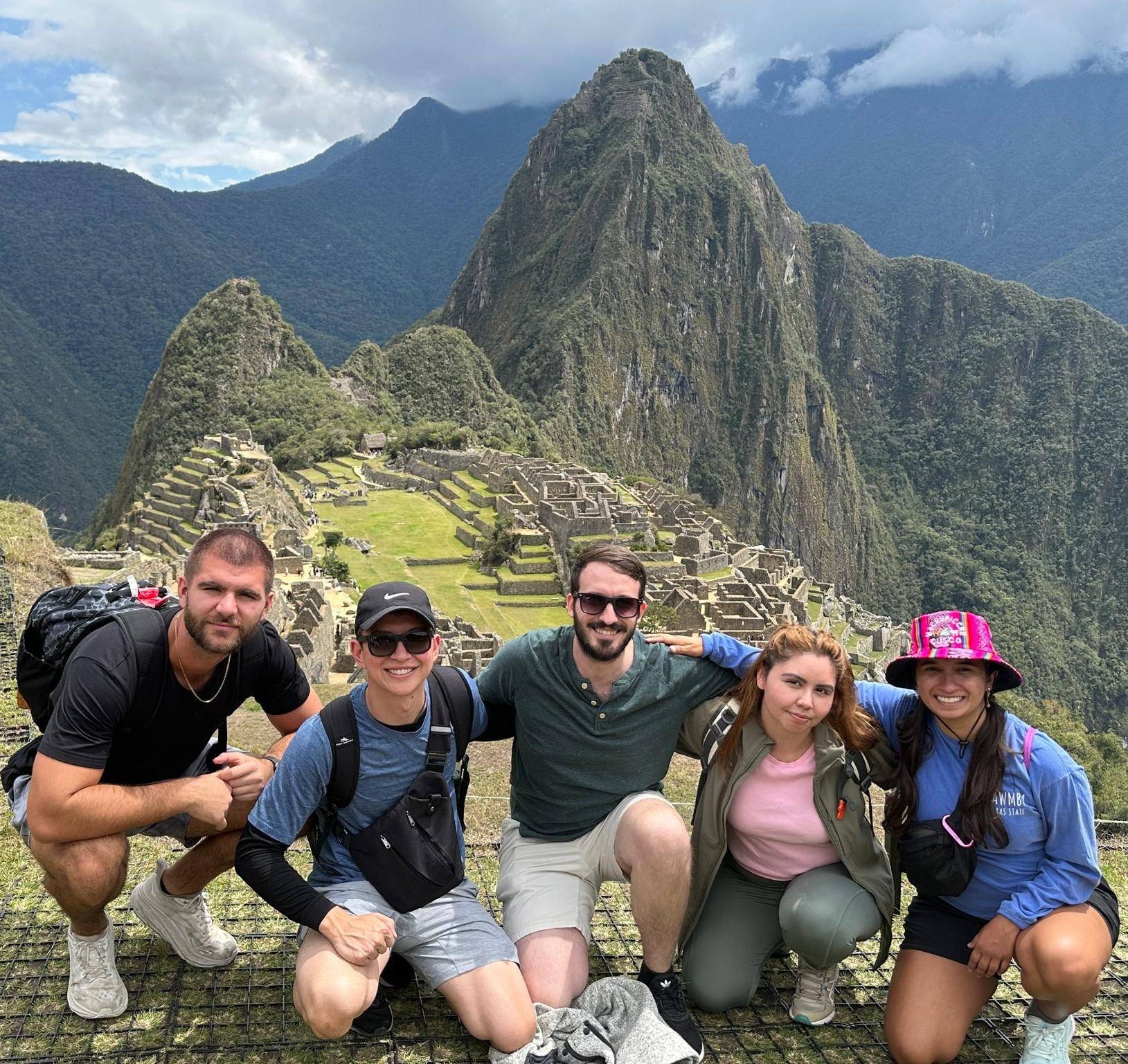 students posed in front of Machu Picchu in Peru