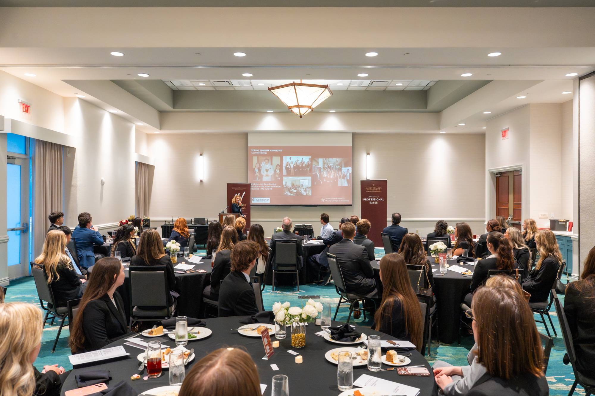 room full of students sitting at tables