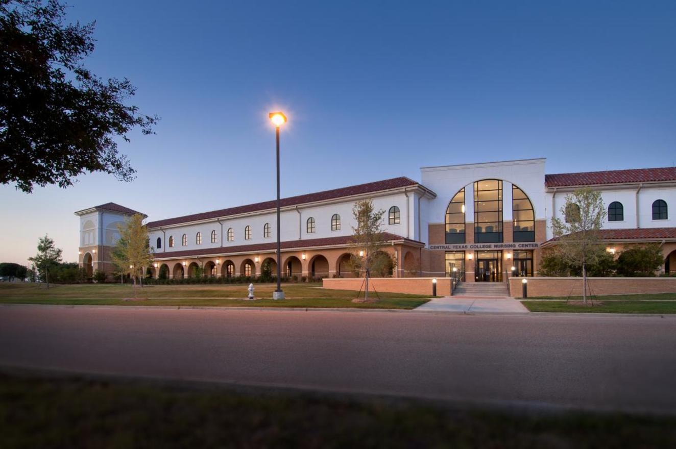 exterior of campus build made of red and white bricks