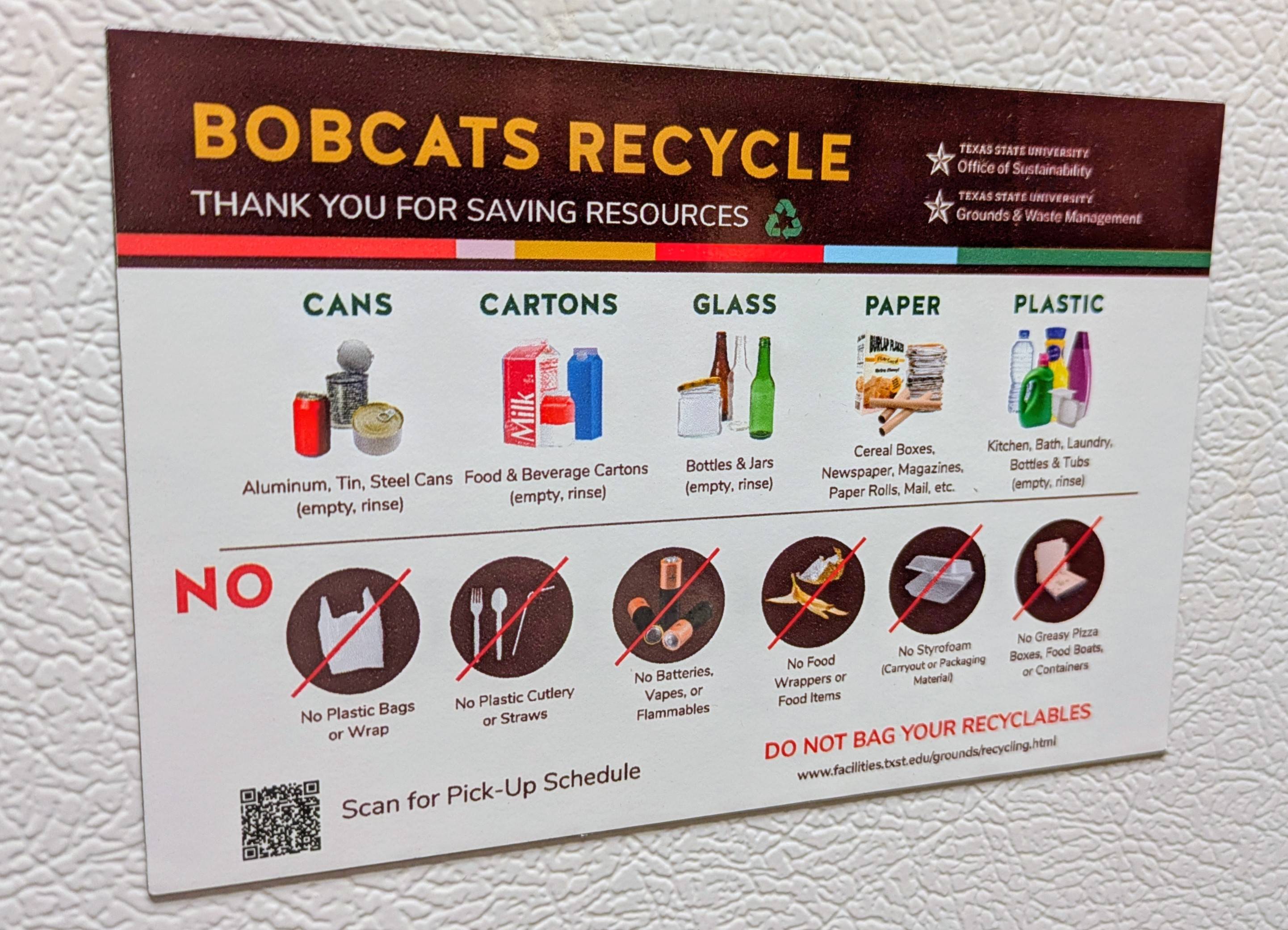 a magnet that says "bobcats recycle" on a refrigerator door