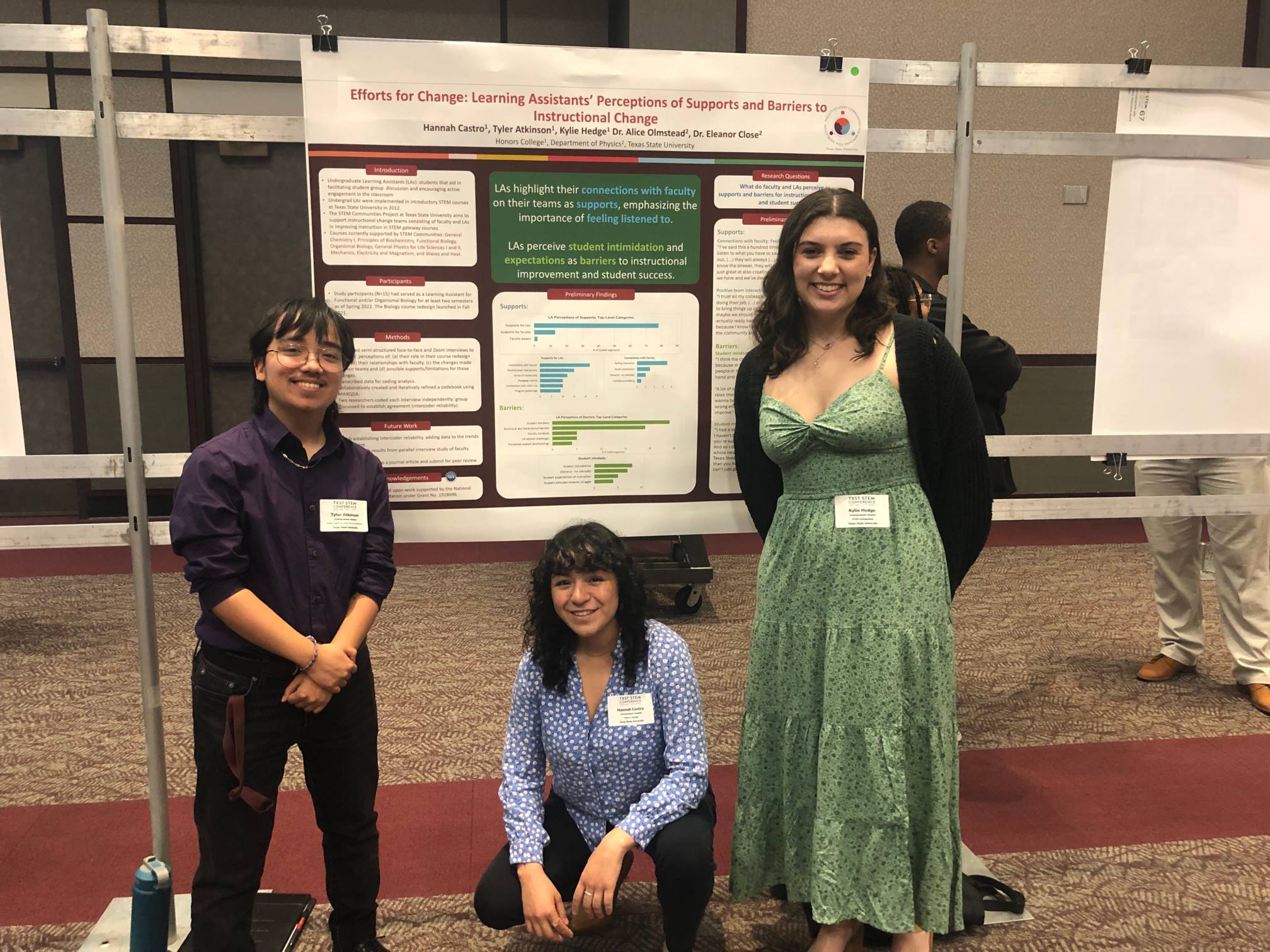 Three students presenting a poster titled: Effects for Change Learning Assistnats Perceptions of Supports and Barriers to Instructional Changes 