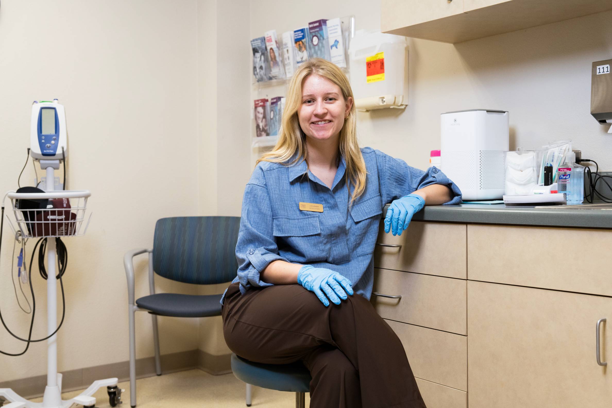 Staff at the university health center sitting in a healthcare room